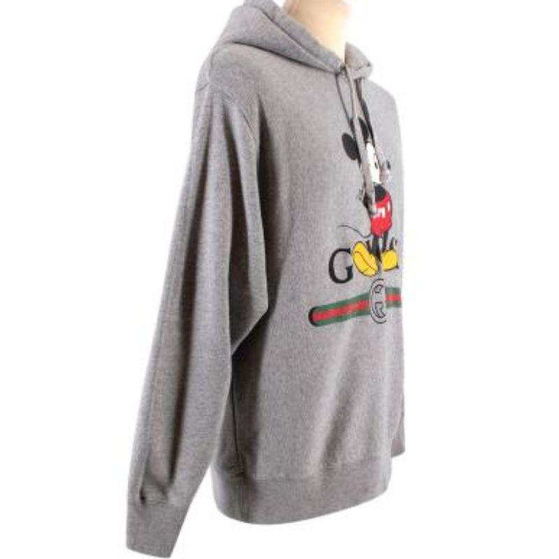 Disney X Gucci Mickey Mouse Printed Grey Hoodie

-Disney Mickey mouse print 
-Hooded with draw strings 
-RIbbed hem & cuffs 
-Logo print 

Material: 

100% Cotton

Made in Italy 

PLEASE NOTE, THESE ITEMS ARE PRE-OWNED AND MAY SHOW SIGNS OF BEING