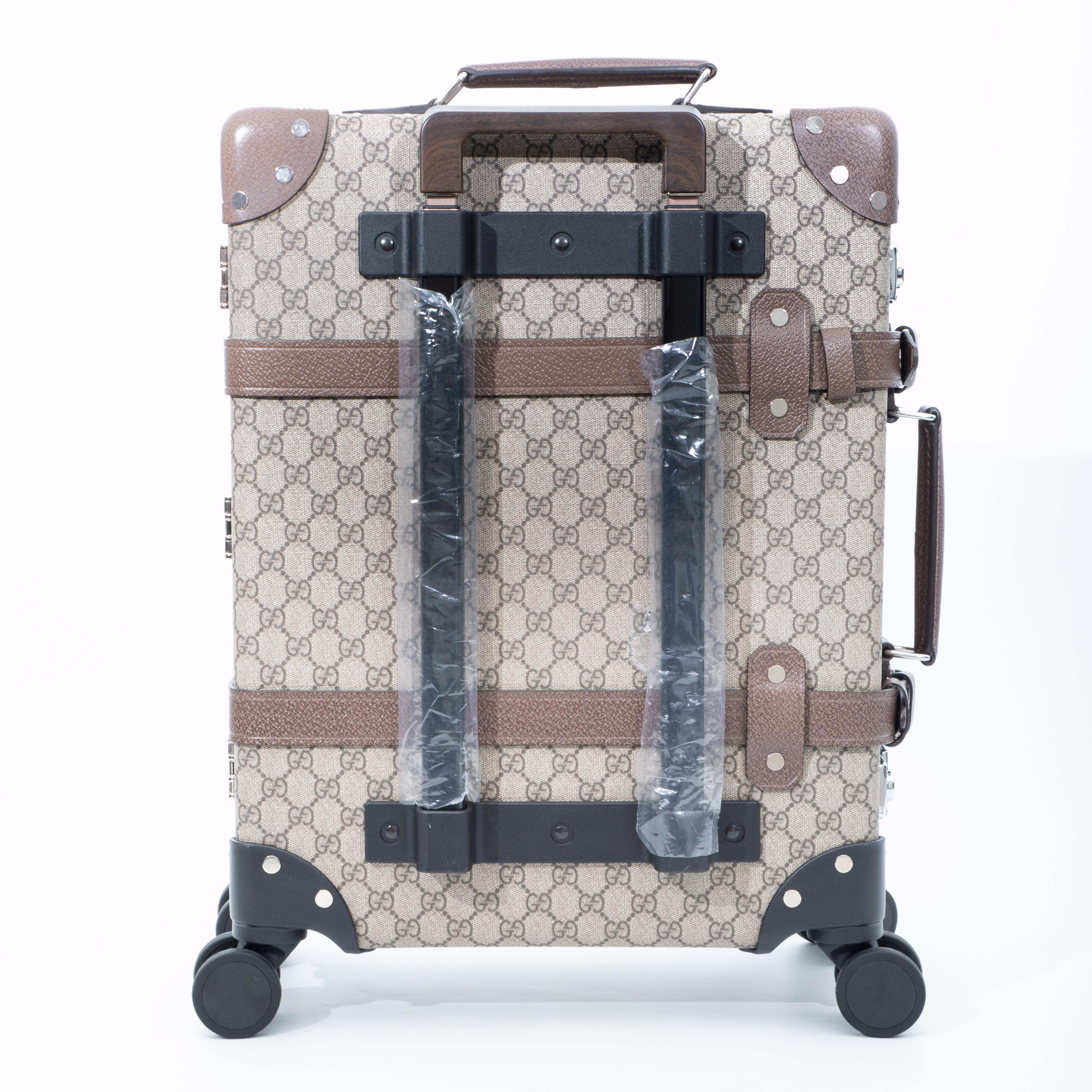 This suitcase is a collaboration between the British luggage label Globe Trotter and Gucci. The heritage travel brand Globe Trotter and Gucci handcrafted this suitcase in Hertfordshire, England by local artisans from GG-Supreme jacquard using