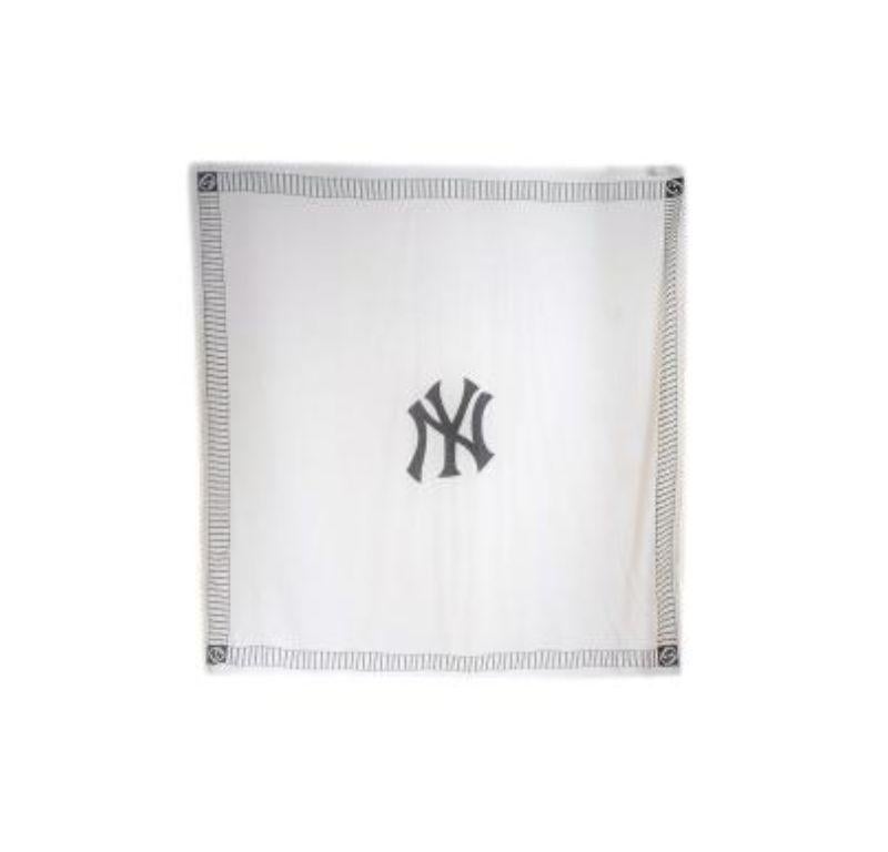 Gucci x New York Yankees Scarf

- Sheer cream scarf
- Black graphics along the border of the scarf with the New York Yankees logo in the middle
- Fringe detailing along the edge of the scarf 

Material
85% Modal, 15% Silk

Made in Italy

Dry clean