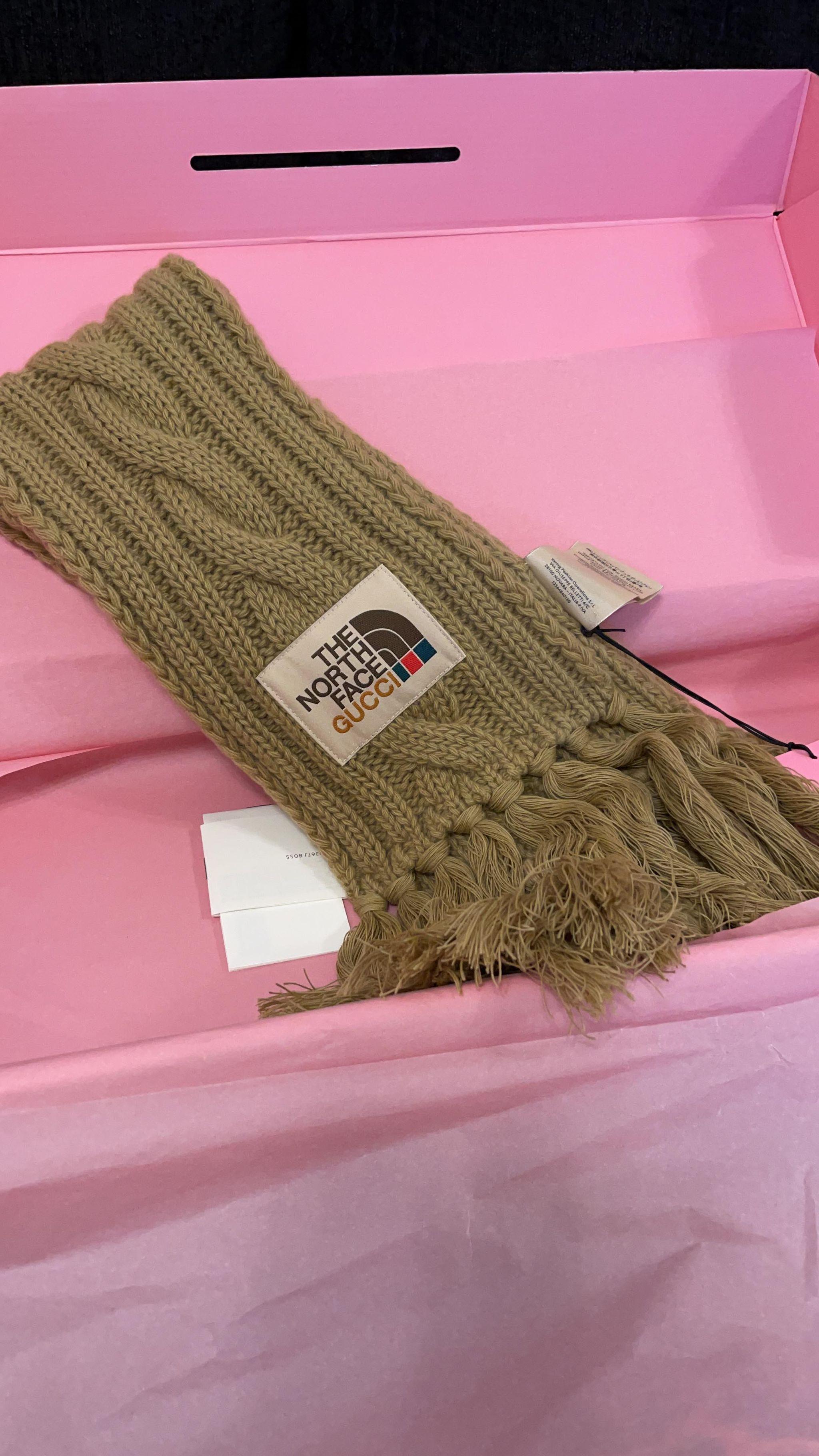 Part of The North Face X Gucci Collaboration, this wool scarf is available in beige. Sold out and is a collectors item.

Brand New and includes the Pink Gucci x North Face special box. 