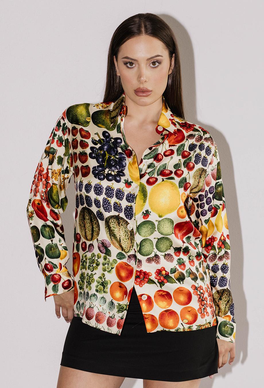From Tom Ford’s iconic 1996 collection for Gucci, this vintage silk shirt is a true collector’s piece, encapsulating the era’s bold aesthetic. Printed with a vibrant fruit motif, it’s a whimsical take on opulence, showcasing Ford’s playful yet