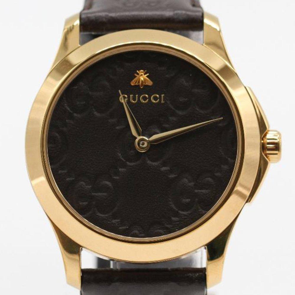 GUCCI Watch YA1264035 Brand New Watch, 38mm gold plated stainless steel case excluding crown. Case thickness 8mm. Sapphire crystal. Black dial. Brown leather strap. Buckle clasp. Strap width 18mm. Quartz movement. Water resistant 3atm. Delivered