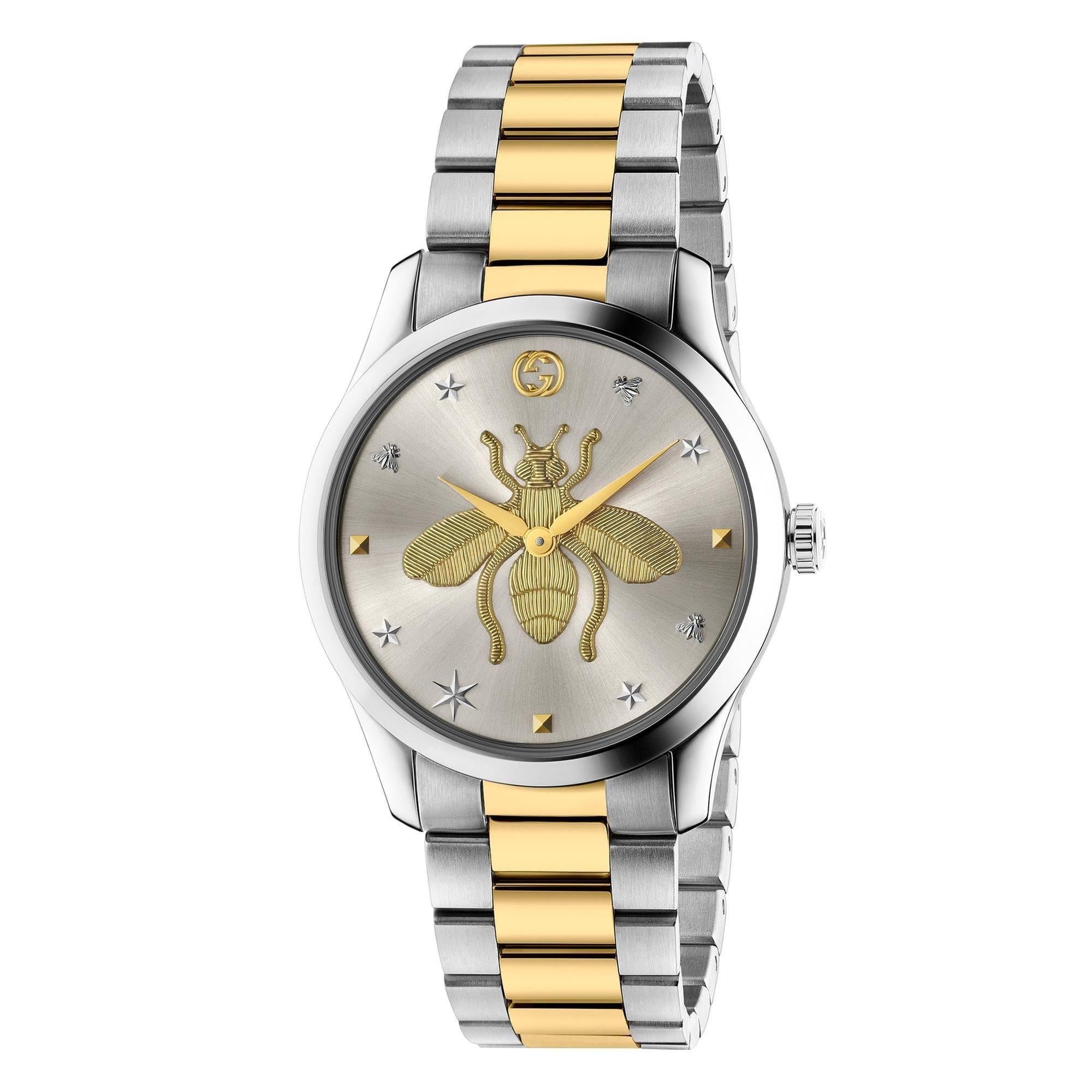 GUCCI YA1264131 G-TIMELESS WATCH

Part of the G-Timeless collection, this watch is designed with a mix of steel and yellow gold PVD. The silver sun brushed dial features a gold-toned Gucci bee at the center, surrounded by other codes of the House