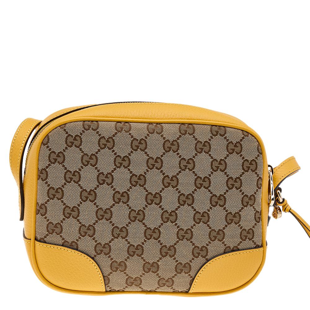 Let the styles you embrace identify the diva within you. This Bree bag designed by Gucci provides a style so eternal and classy, parting with it is nearly impossible. Crafted with beige-yellow GG canvas and leather with gold-toned hardware, this bag