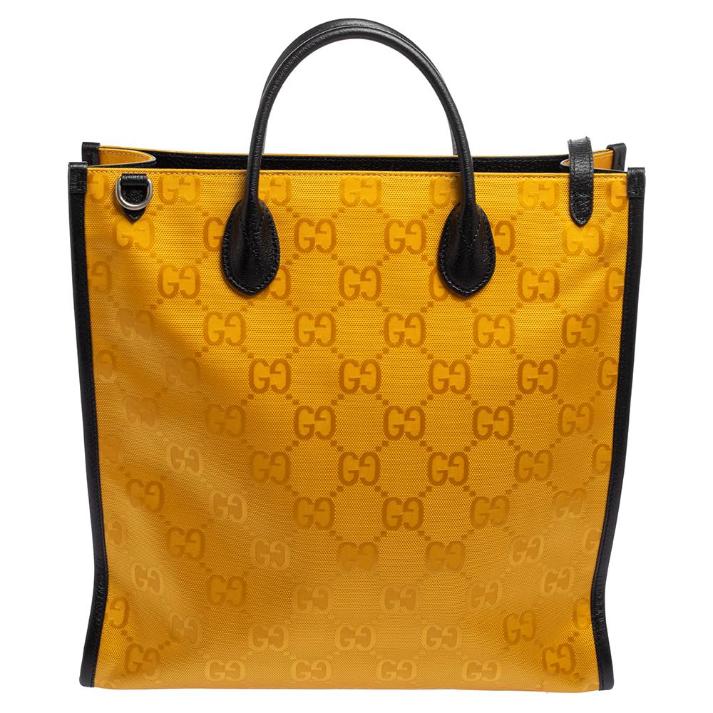 This richly crafted, trendy yellow and black GG nylon and leather tote is designed to complement your bold and confident personality. A silky-soft fabric lining made with nylon lends a grand touch to the bag. Have all eyes on you as you head out