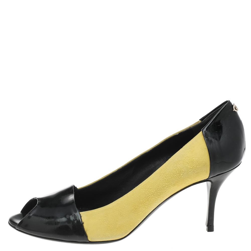 Embrace new styles and trends as you wear these pumps from the House of Gucci. They are made from yellow-black suede and leather on the exterior, granting them an exceptionally glamorous look. These pumps show peep-toes, a slip-on, and pointy heels.