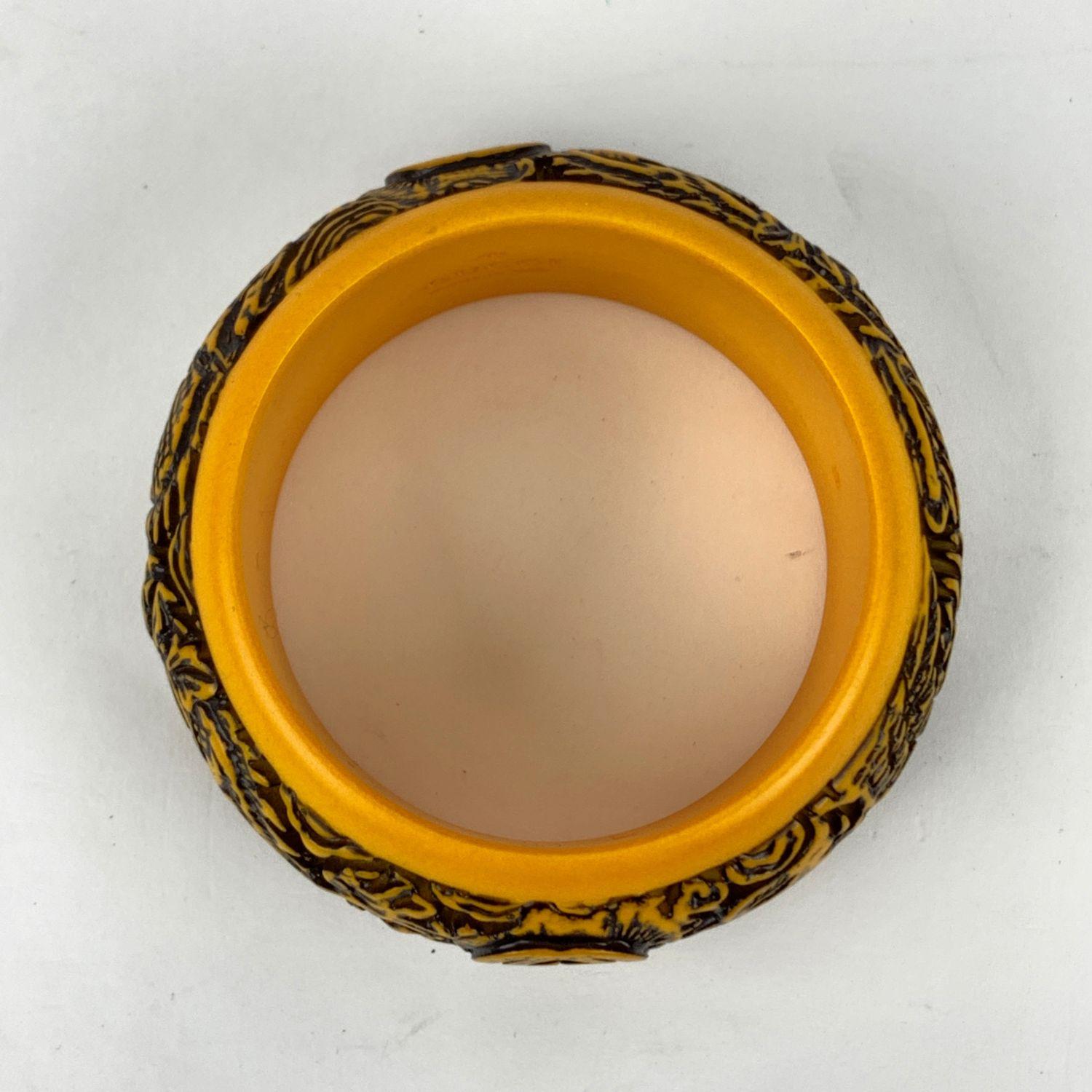 Beautiful bangle bracelet by Gucci, from the 2018 Fall collection. Made in yellow resin. It features a stunning engraved dragon motif with carved Gucci Logo on top. Size: S. Inner circumference: 7.5 inches - 19 cm. Inner diameter: 2.5 inches - 6 cm.