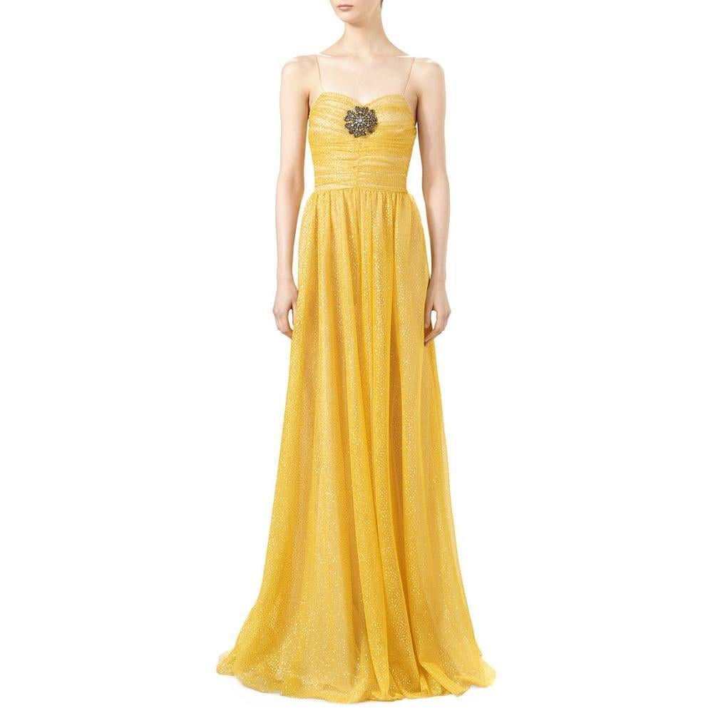 Renowed for creative style infused with romantic references from past archives, Gucci's Glitter Tulle Gown is an eccentric, colourful and romantic choice for evening occassions.
Made in Italy from yellow glitter tulle, this ultra-feminie style is