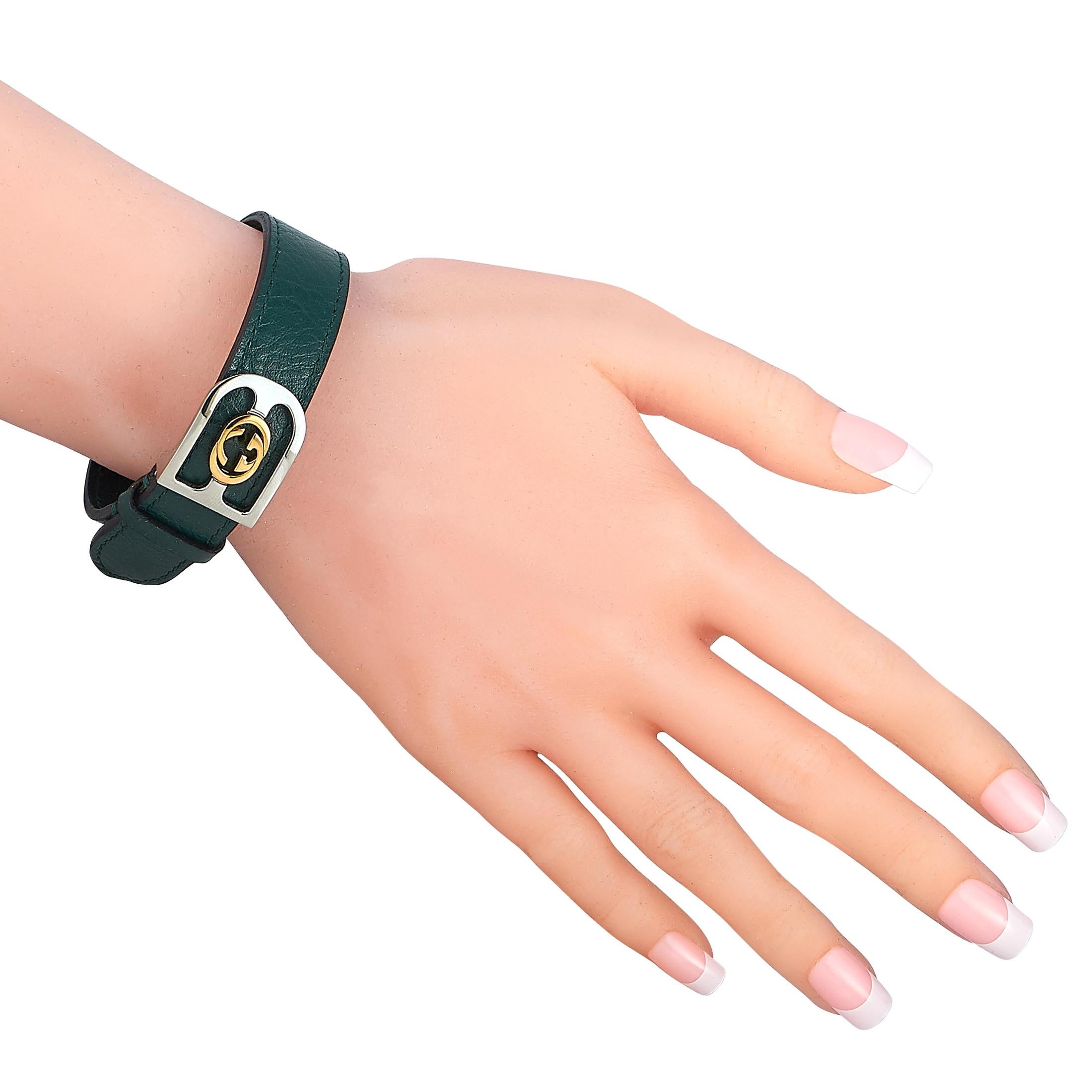 This Gucci bracelet is made of green azalea leather and fitted with an 18K yellow gold and stainless steel deployment clasp, accentuated with the iconic Interlocking G logo. The bracelet weighs 17.3 grams and measures 8” in length.

Offered in brand