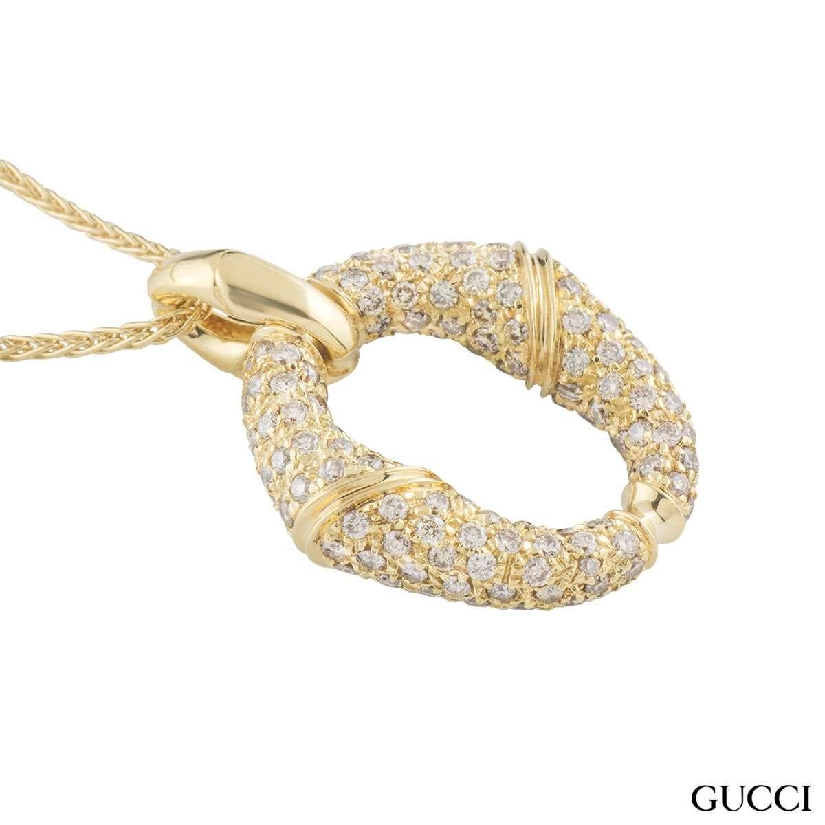 A unique 18k yellow gold diamond Gucci pendant from the Bamboo collection. The pendant features a circular bamboo motif pave set with round brilliant cut diamonds totalling approximately 2.82ct. The motif measures 2.3cm in width and 3.1cm in height