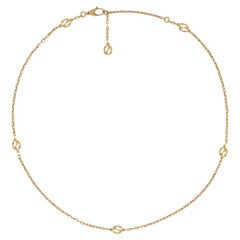 Gucci Collana con Charm a G intrecciate in oro giallo YBB629901001