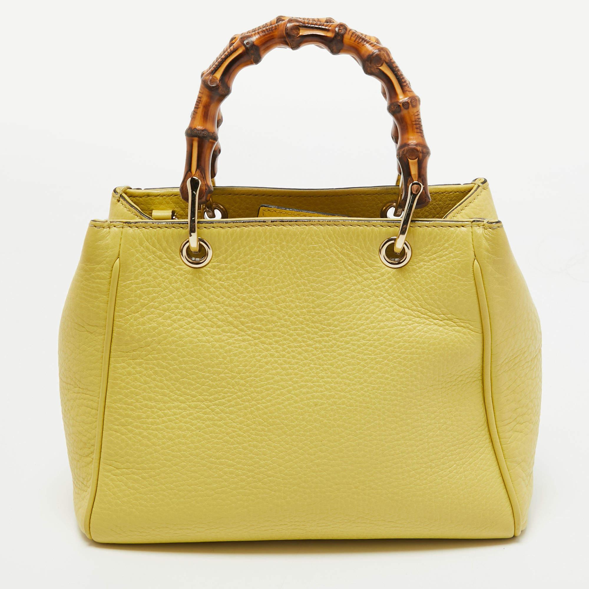 Handbags as fabulous as this one are hard to come by. So, own this gorgeous tote from Gucci today and light up your closet! Crafted from yellow leather, this tote has a spacious interior and is wonderfully held by two Bamboo handles, making the