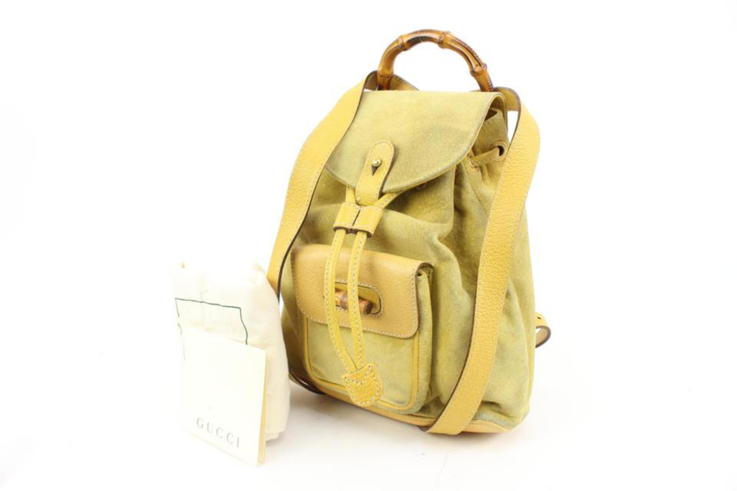 Gucci Yellow Suede Mini Bamboo Backpack 54gz421s
Date Code/Serial Number: 003-2058-0030
Made In: Italy
Measurements: Length:  9.5