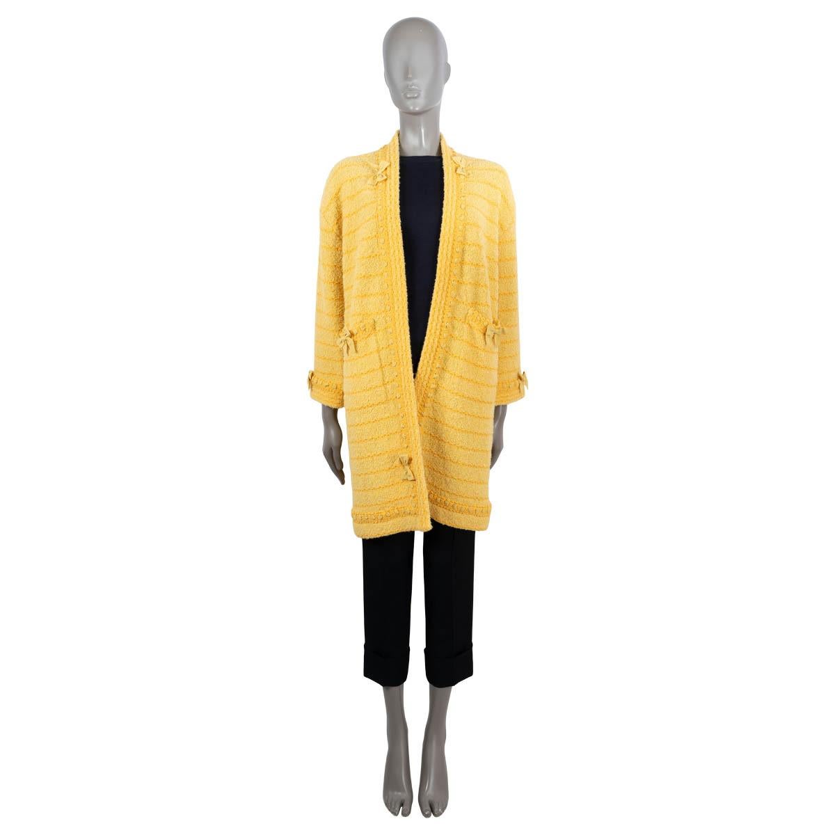 100% authentic Gucci open striped bouclé knit coat in two tone yellow wool (with 5% polyamide). Features ribbon trims with bows and two open pockets. Unlined. Has been worn and is in excellent condition.

2020 Resort

Measurements
Tag