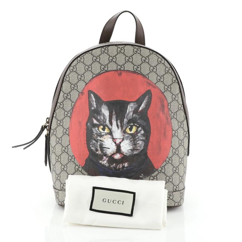This Gucci Zip Backpack Bosco Print GG Coated Canvas Small, crafted in brown Bosco print GG coated canvas, features a suede patch embroidered with the image of Bosco, the Boston terrier, adjustable shoulder straps, and aged gold-tone hardware. Its