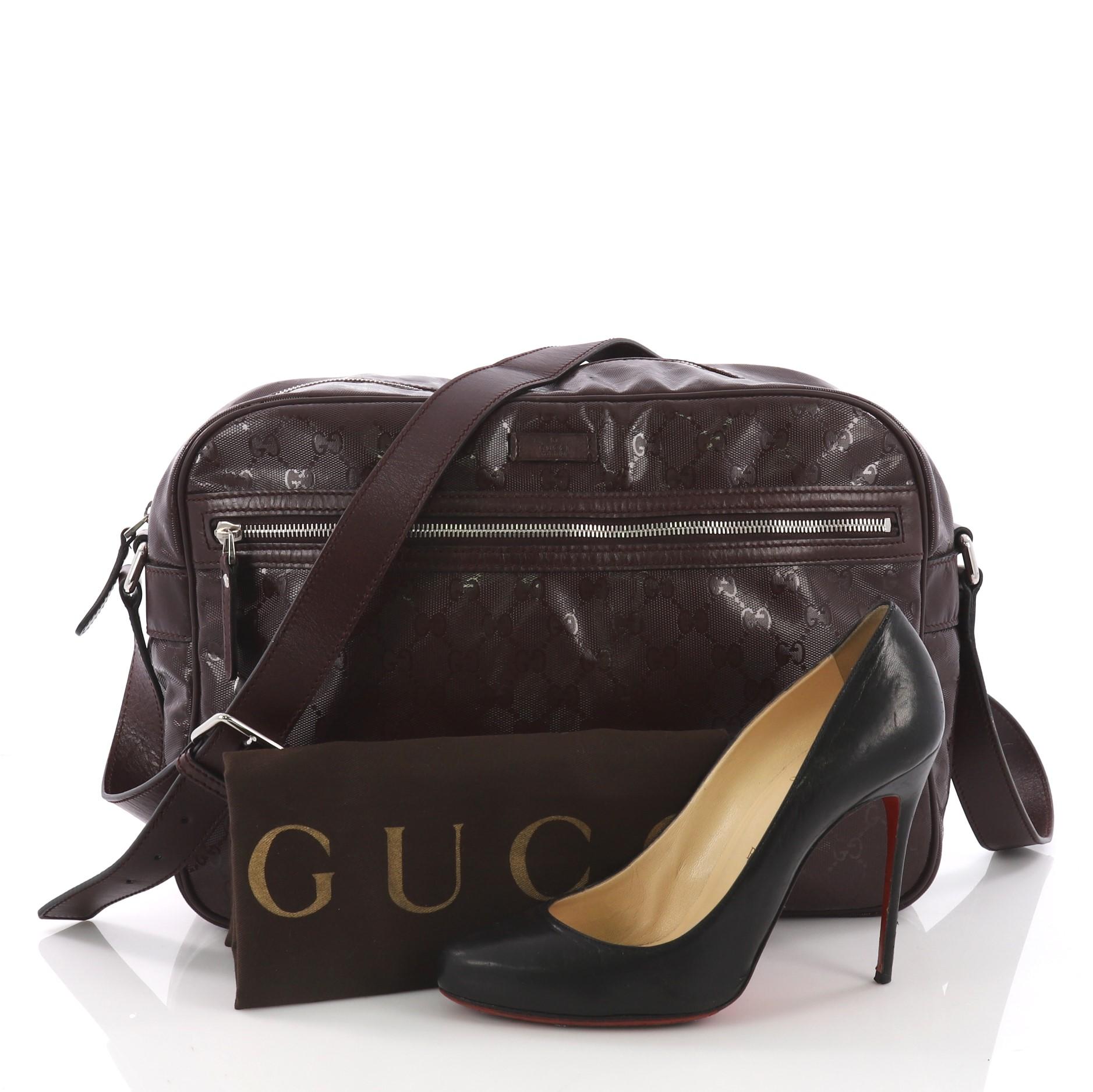 This Gucci Zip Messenger Bag GG Imprime Small, crafted from burgundy GG imprime, features an adjustable shoulder strap, and silver-tone hardware. Its zip closure opens to a burgundy fabric interior with side zip pocket. **Note: Shoe photographed is