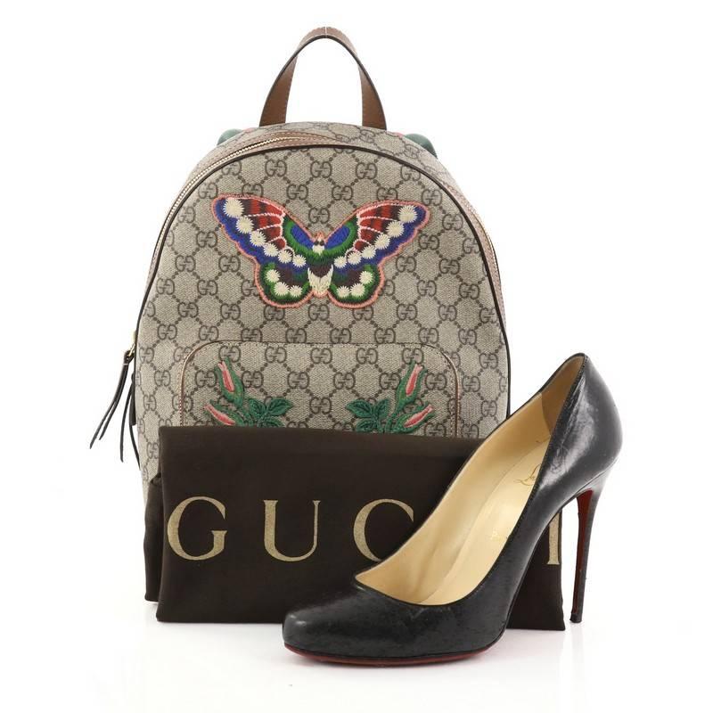 This authentic Gucci Zip Pocket Backpack Embroidered GG Coated Canvas Small is a special limited-edition backpack great for traveling with ultimate hands-free convenience. Crafted from taupe GG supreme coated canvas, this sleek backpack features
