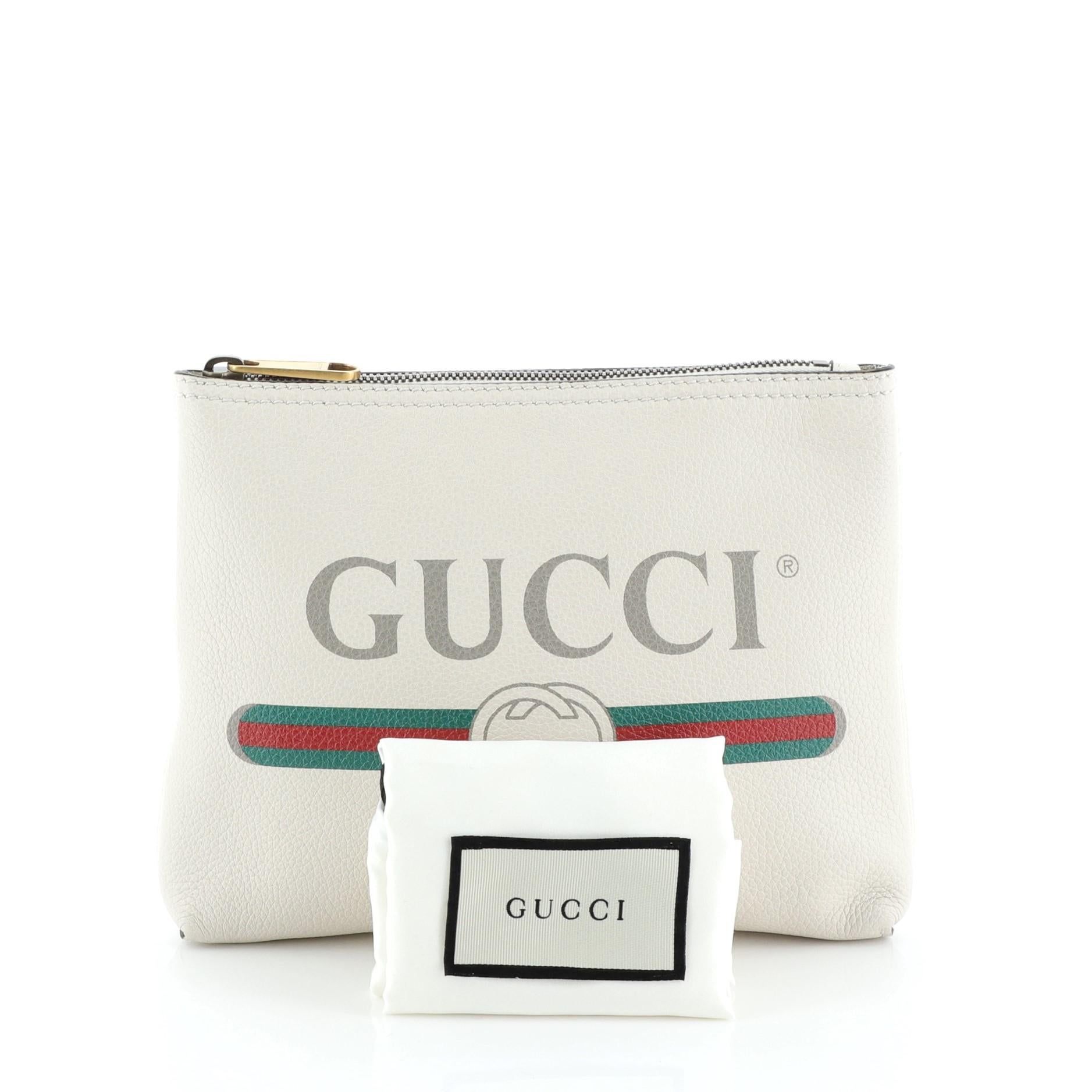 This Gucci Zipped Pouch Printed Leather Small, crafted from neutral printed leather, features Gucci vintage logo print and aged gold-tone hardware. Its zip closure opens to a neutral suede interior. 

Estimated Retail Price: $875
Condition: