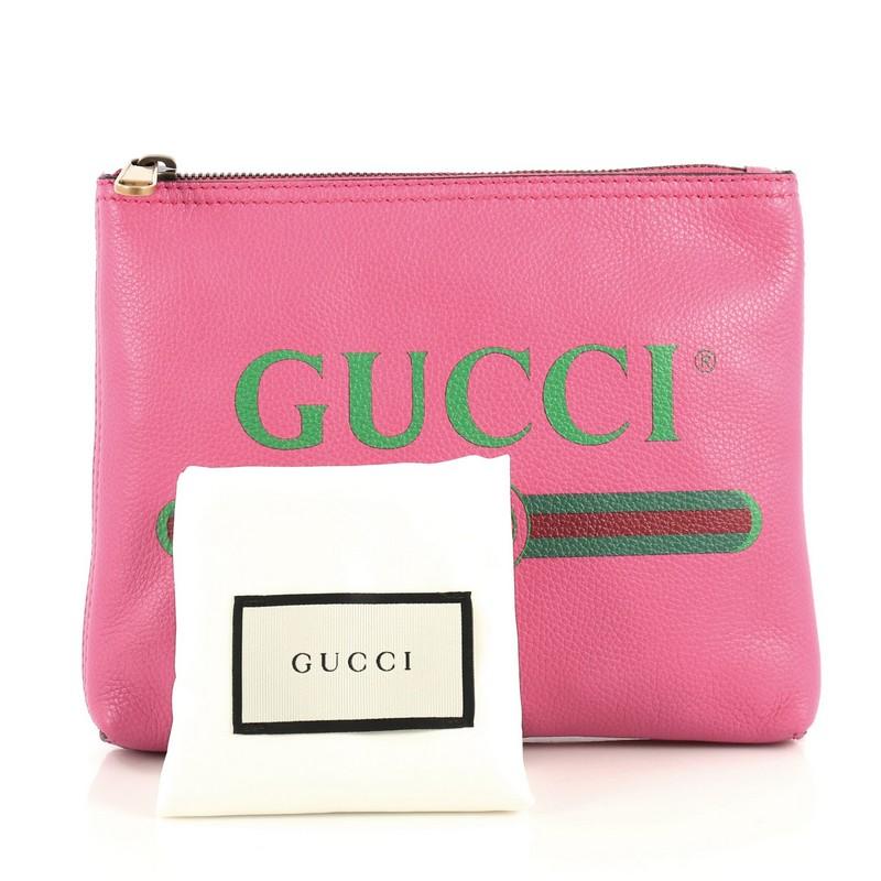 This Gucci Zipped Pouch Printed Leather Small, crafted from pink printed leather, features Gucci vintage logo print and aged gold-tone hardware. Its zip closure opens to a pink suede interior.

Estimated Retail Price: $875
Condition: Great. Minor