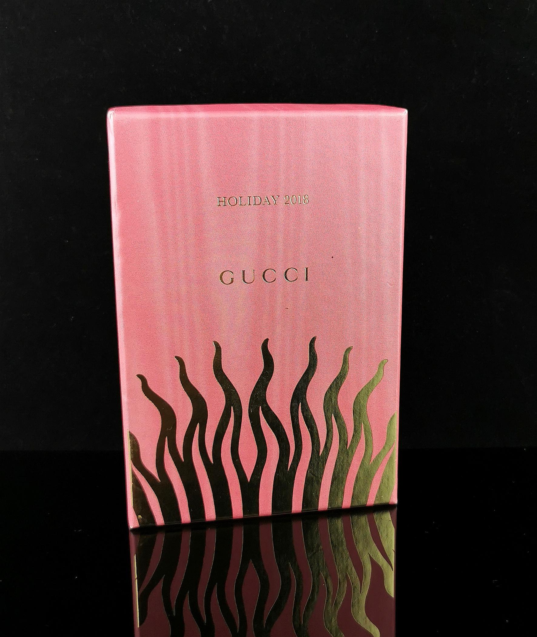 A gorgeous Gucci Zumi Trapuntata Card Case Wallet in Metallic Laminated Calfskin. 

Multiple compartments with a space for cards and a zip compartment with floral cotton lining. 

Lovely vibrant metallic tones of red, pink and purple. 

Gold tone
