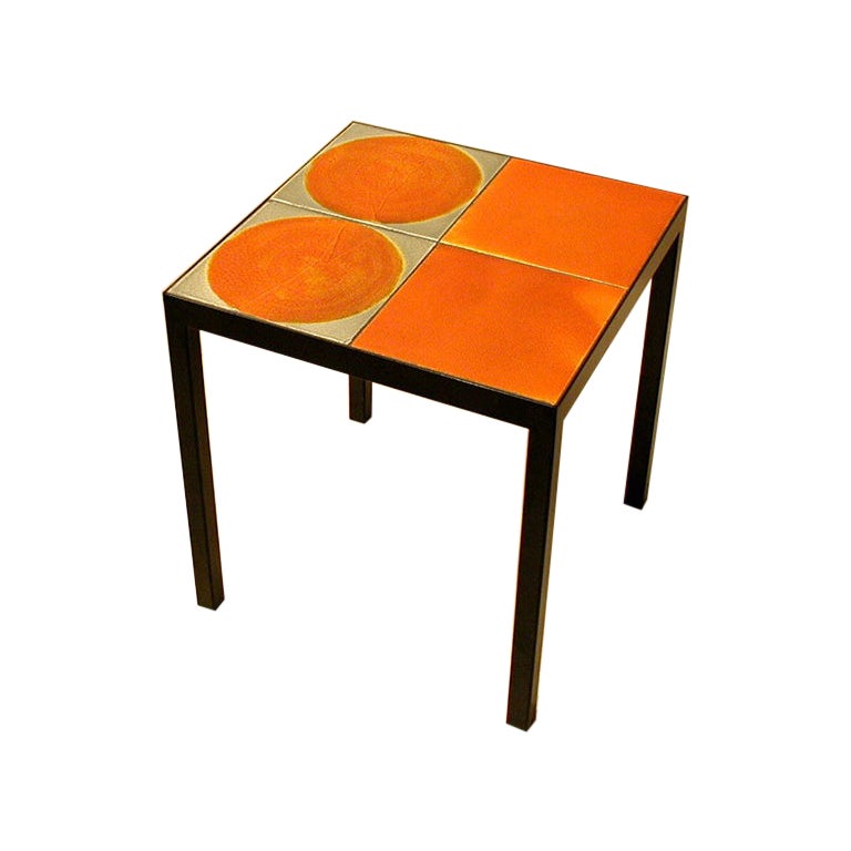 This coffee table is made with 4 ceramic tiles made in the 1970's by Roger Capron, one of the most well-known ceramist of the Modern era.  Each tile is unique, hand-glazed and varied in color and texture. We use these tiles to create tables, coffee