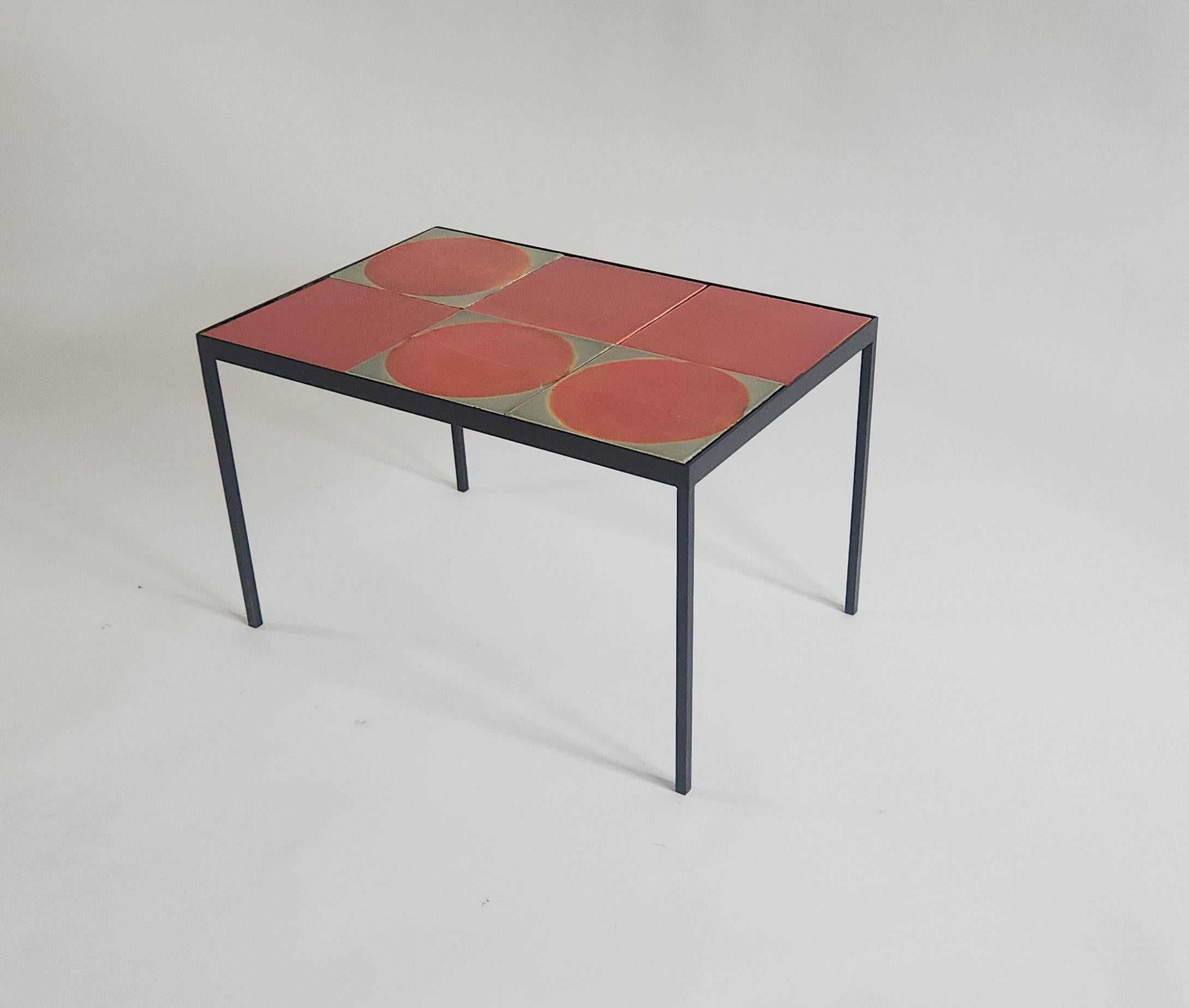 This coffee table is made with six ceramic tiles created in the 1970s by Roger Capron, one of the most renowned ceramists of the Modern era.  Each tile is unique, hand-glazed, and varied in color and texture. We use these tiles to create tables,