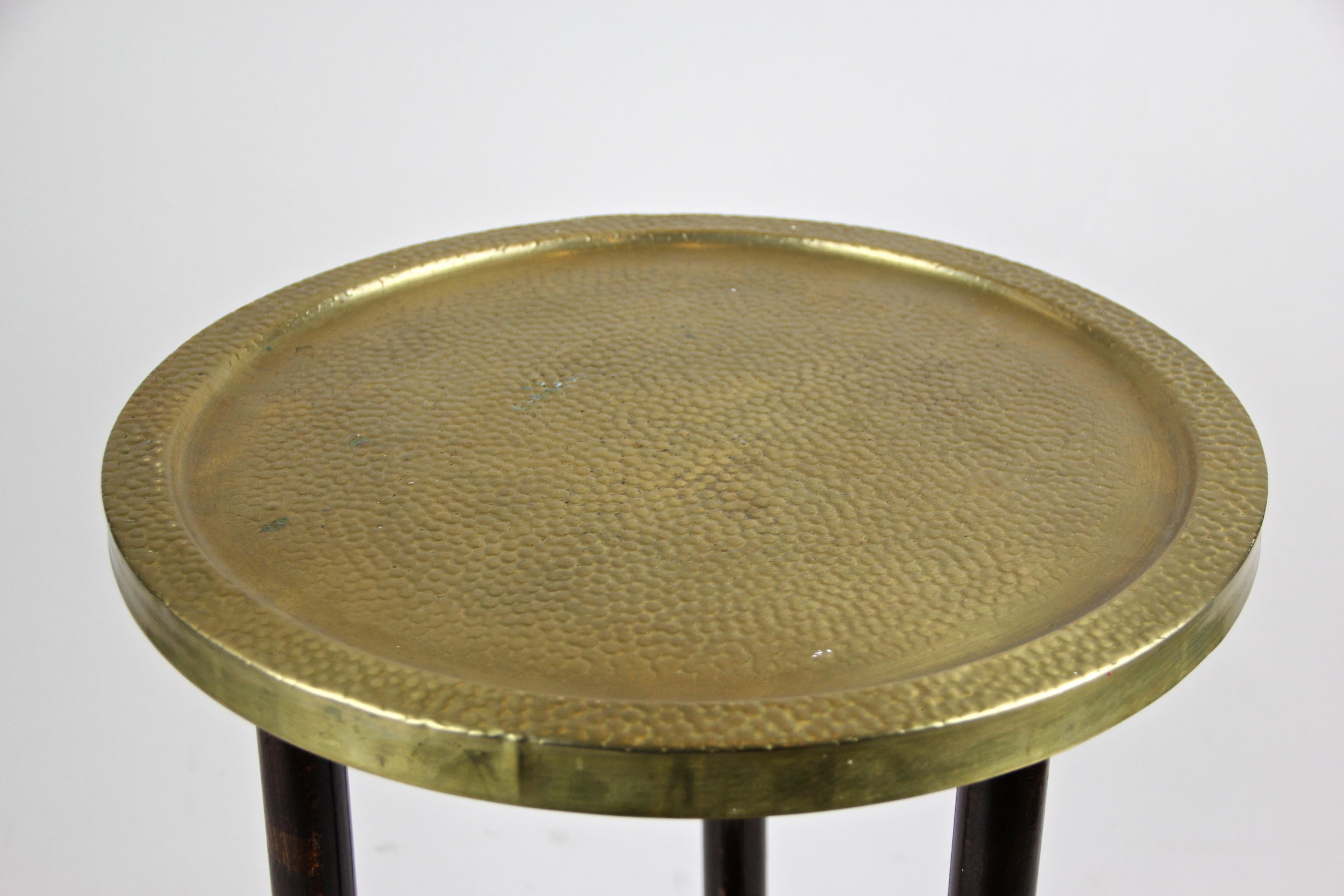 Lovely small Art Nouveau side table or Gueridon table from the period circa 1910 in Austria. This fantastic side table was made of beech and trimmed to a nut wood look. A round plate floating on three small feet and showing a glossy shellac finish,