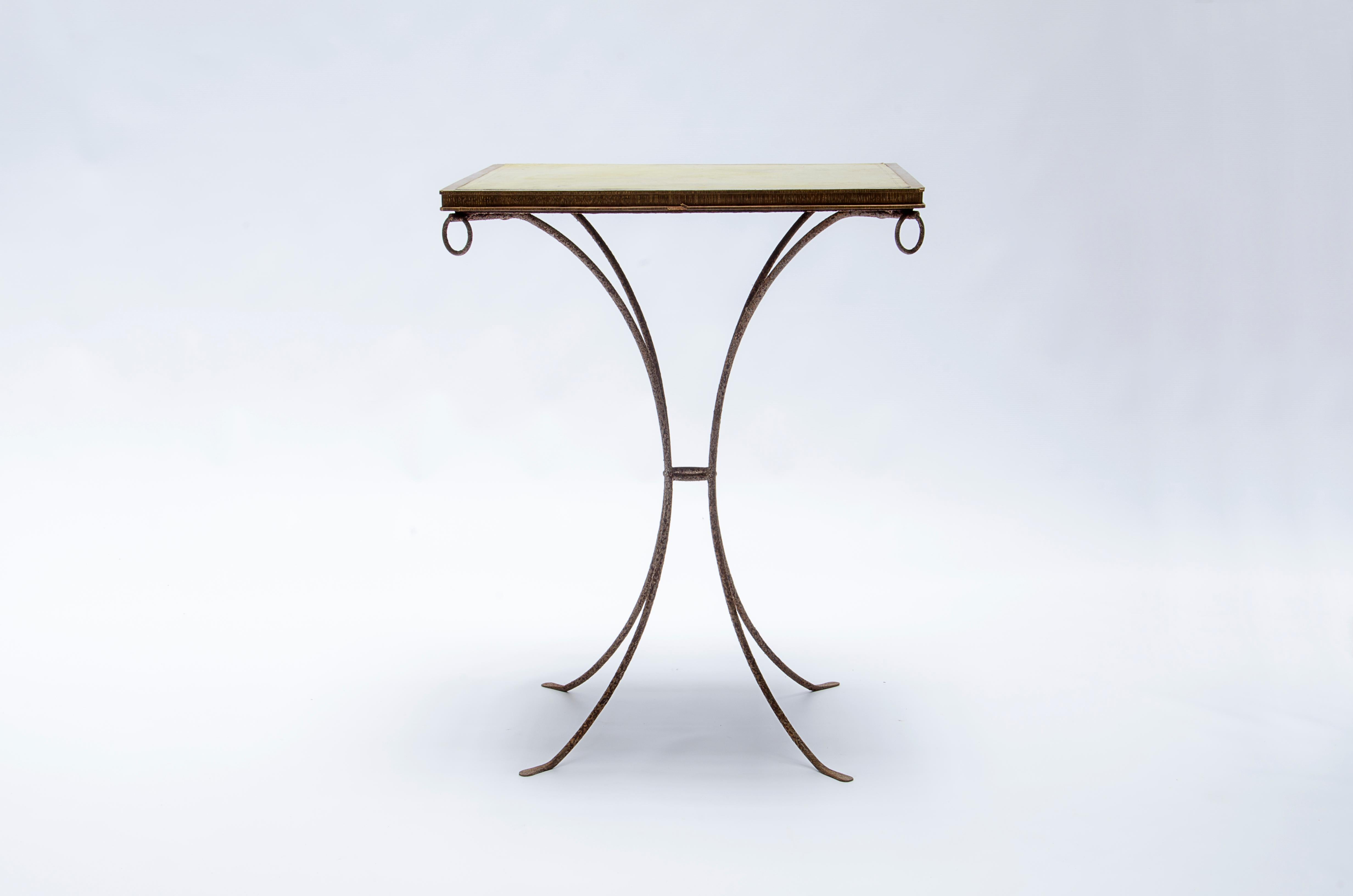 Gueridon table with iron structure, decapé oak wood top and yellow leather. Made by CASA COMTE (1932-1960).

Argentina, CIRCA 1940.

Mo Amelia Teitelbaum (2010) 