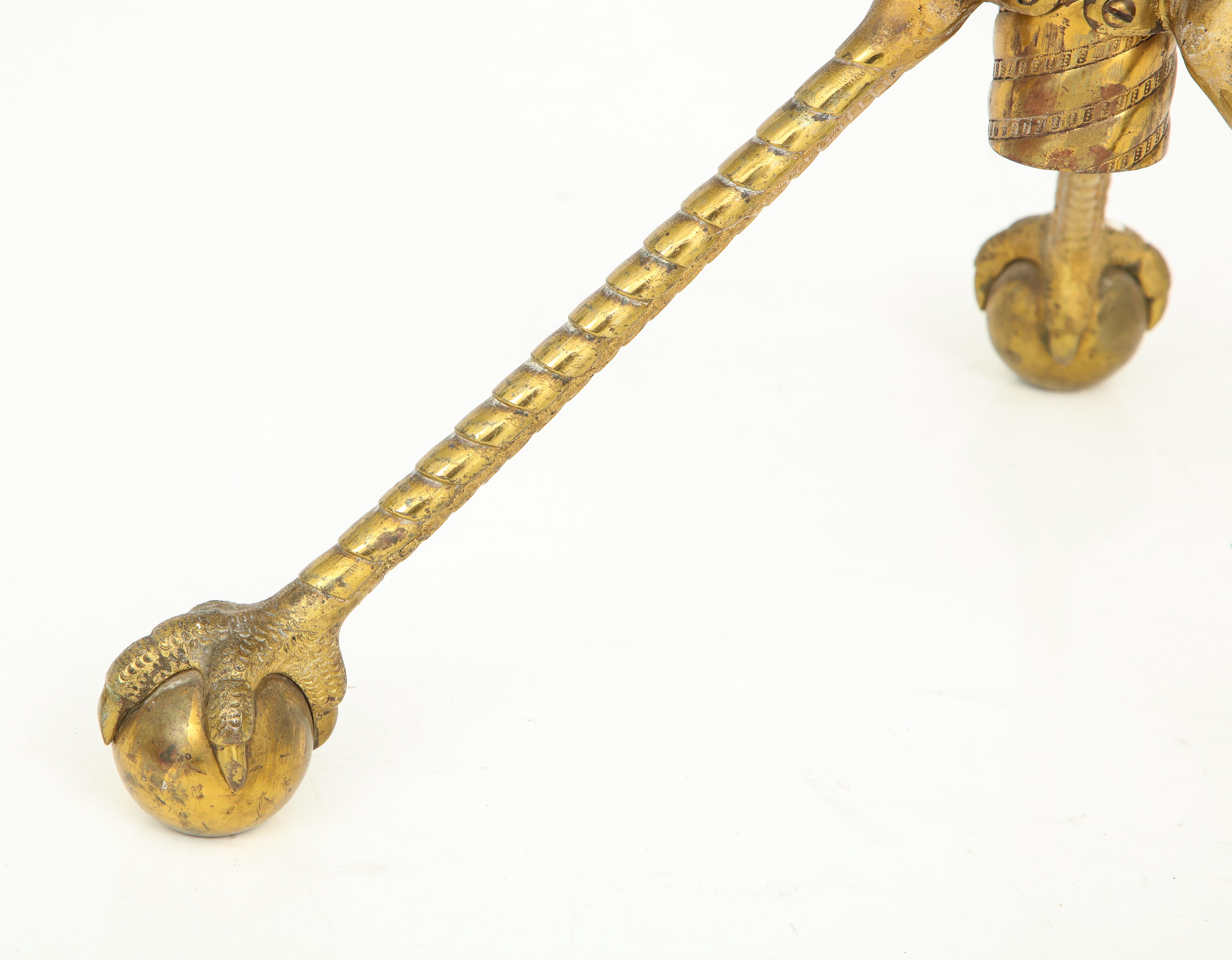 Pedestal table in mahogany, bronze & brass uniquely styled with claw and ball feet, dragon motif with bronze & brass table base