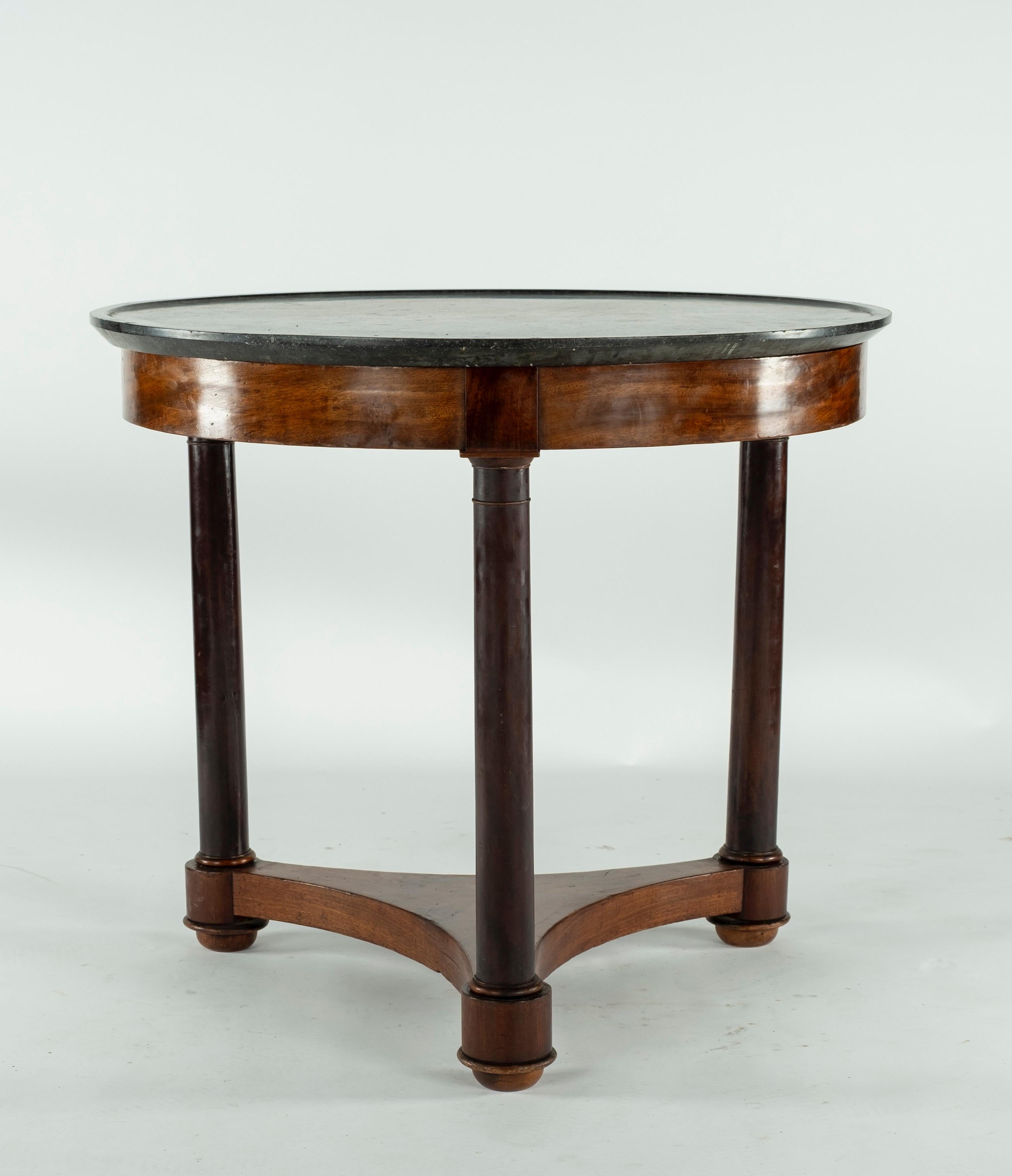 19th century mahogany gueridon with original black marble incised top.