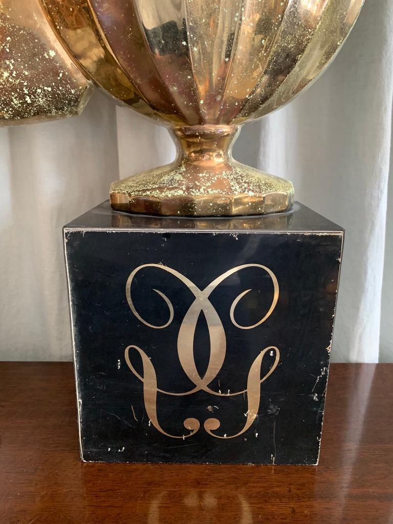 Vintage French promotion stand for the perfume brand Guerlain. The patinated gold colored plastic stand shows an array of Guerlain's iconic perfumes through the times as for example Mitsouko, Jardins de Bagatelle, Chamade, Shalimar etc.
and has an