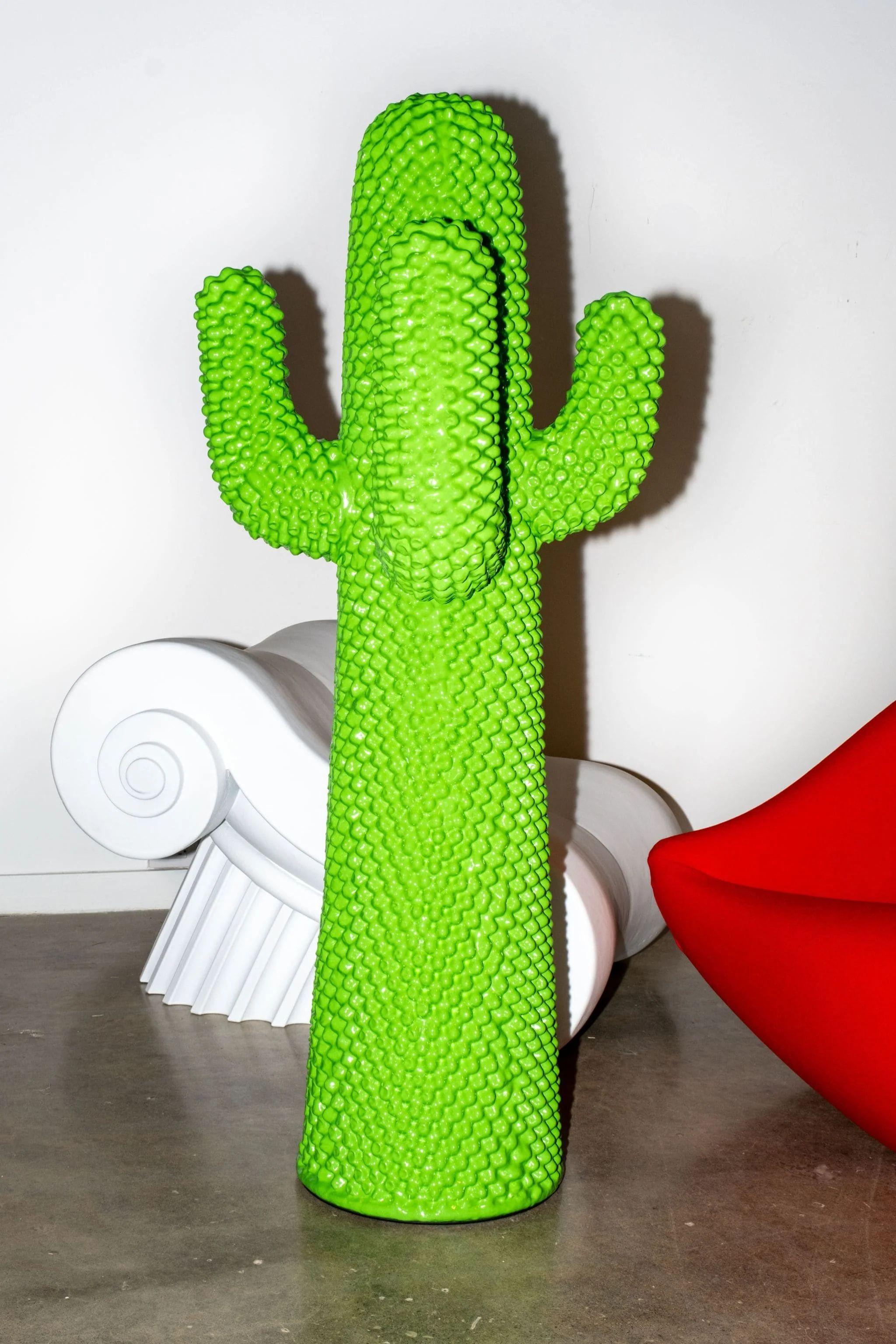 Coat stand of soft polyurethane finished by hand with Guflac®.

Open Edition.

As tall as a human, CACTUS®, initially conceived as an eccentric coat hanger, has become over the years an emblem of radical Italian design. Born from the minds of Guido