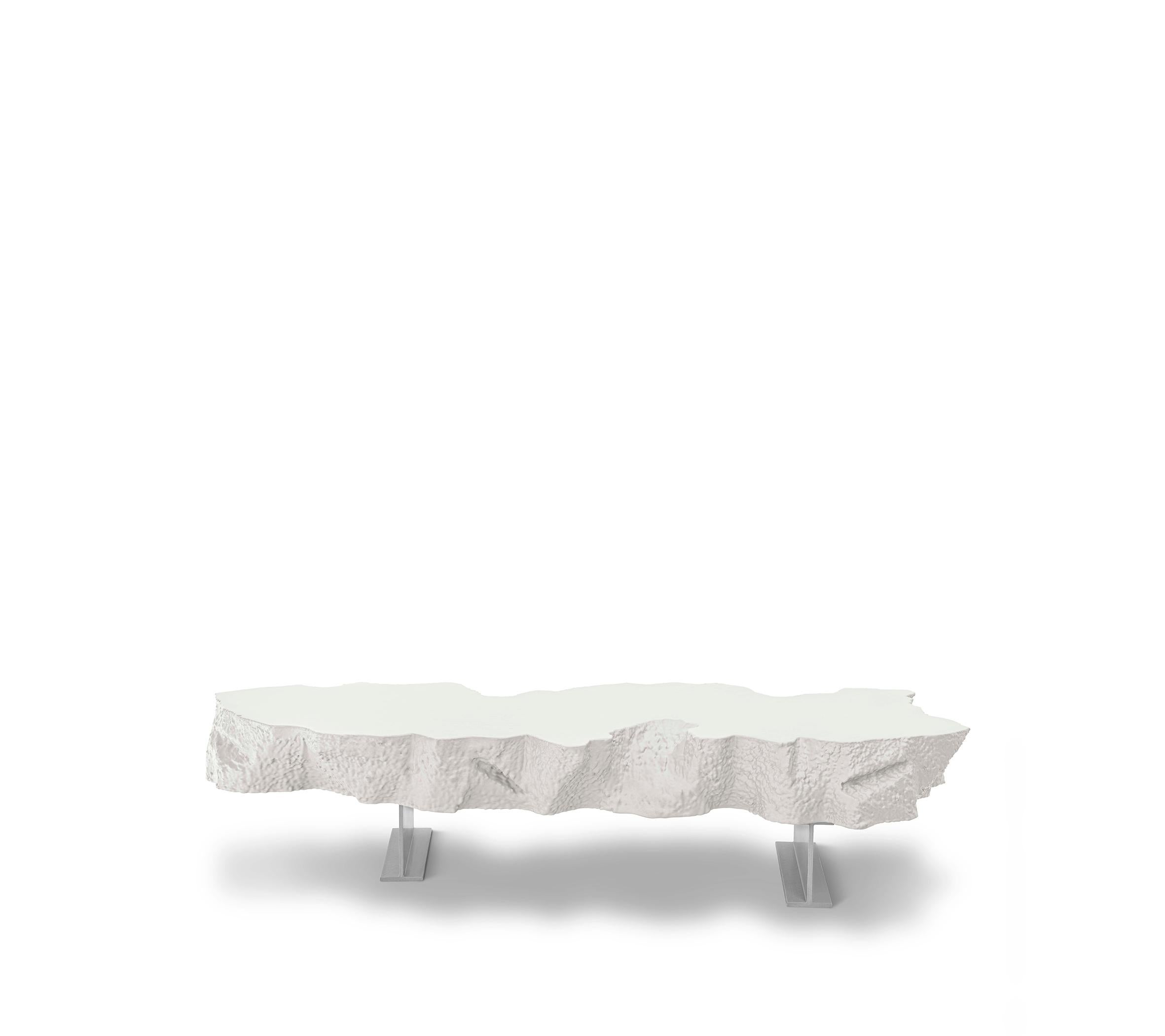 The Broken Bench, an irregular slab of “soft concrete” in polyurethane, seems to be the part missing from the large Broken Mirror, and just like the other pieces of the collection plays with the “short-circuit” between the actual softness of the