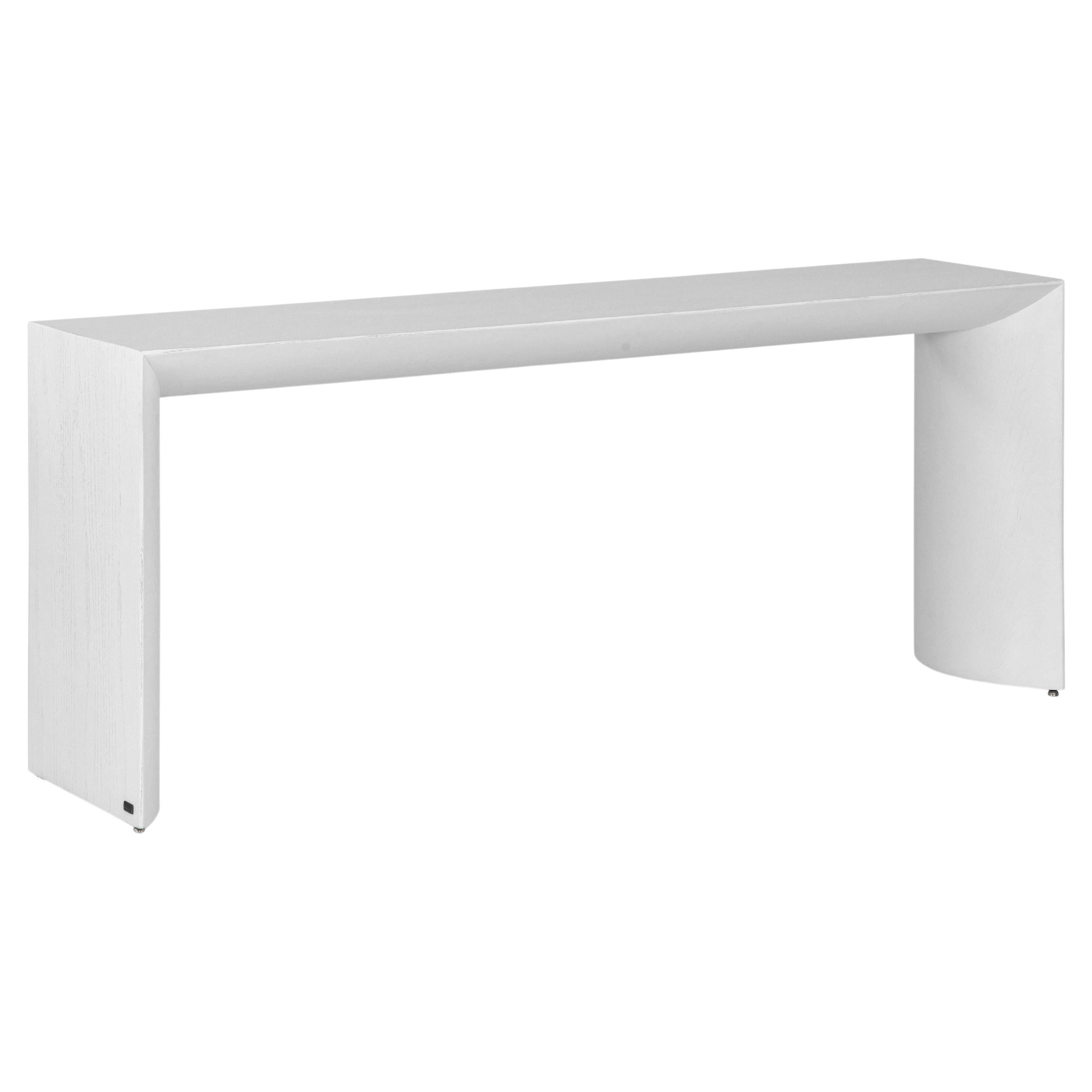 The Gugge console table by Studio + A! for Uultis offers a harmonious blend of artistic inspiration and modern design, making it a standout piece for residential and commercial interiors alike. With its sleek 71-inch top in a refined white oak