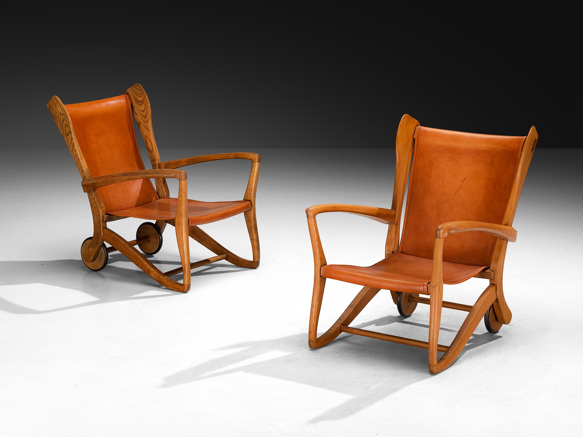 Guglielmo Pecorini, high back lounge chairs, ash wood, leather, brass, Italy, 1950s

Wonderfully sculpted oak chairs featuring rich brown-reddish leather upholstery. Designed by Italian designer Guglielmo Pecorini, this piece masterfully combines