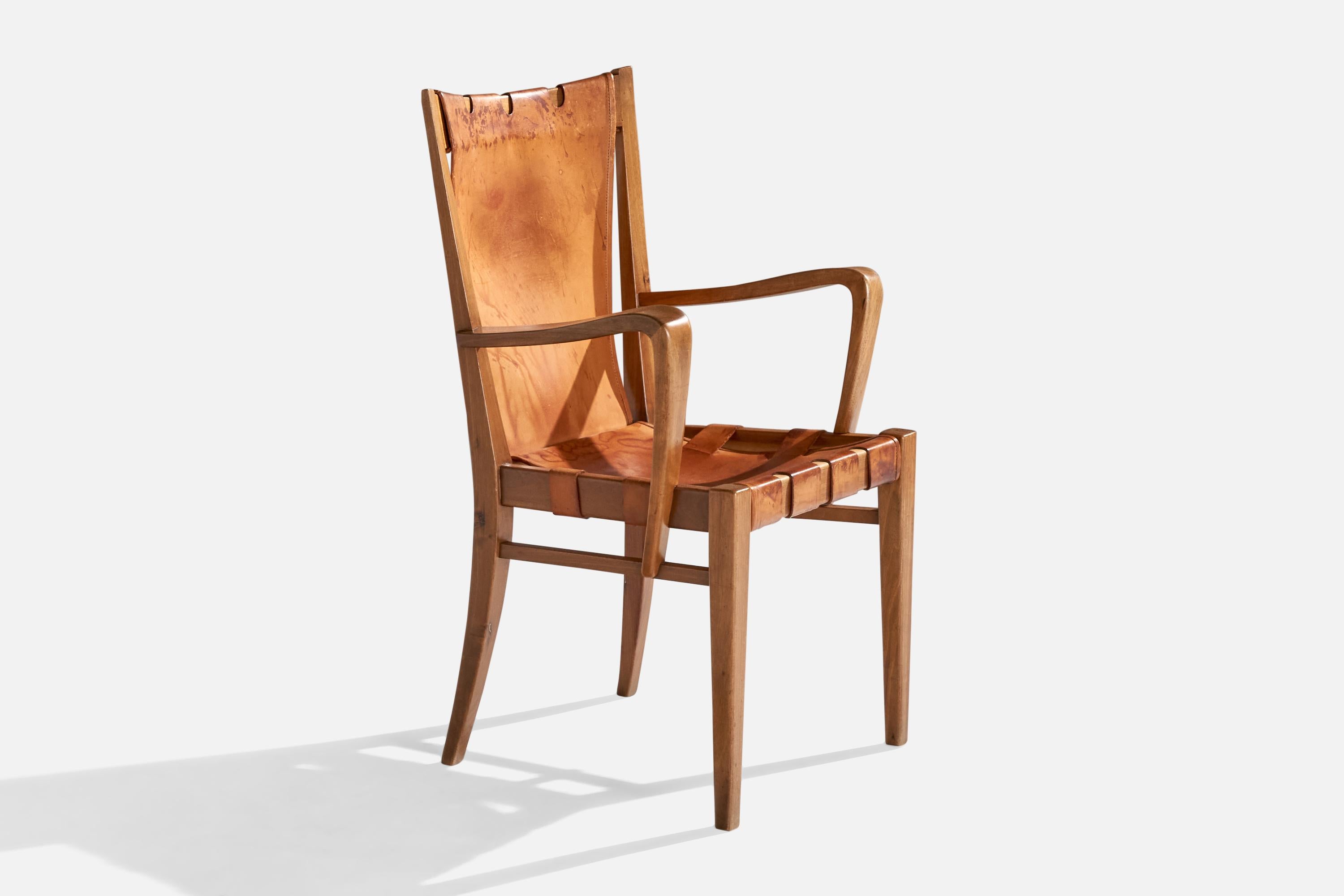 A walnut and leather armchair designed and produced by Guglielmo Pecorini, Italy, 1940s.