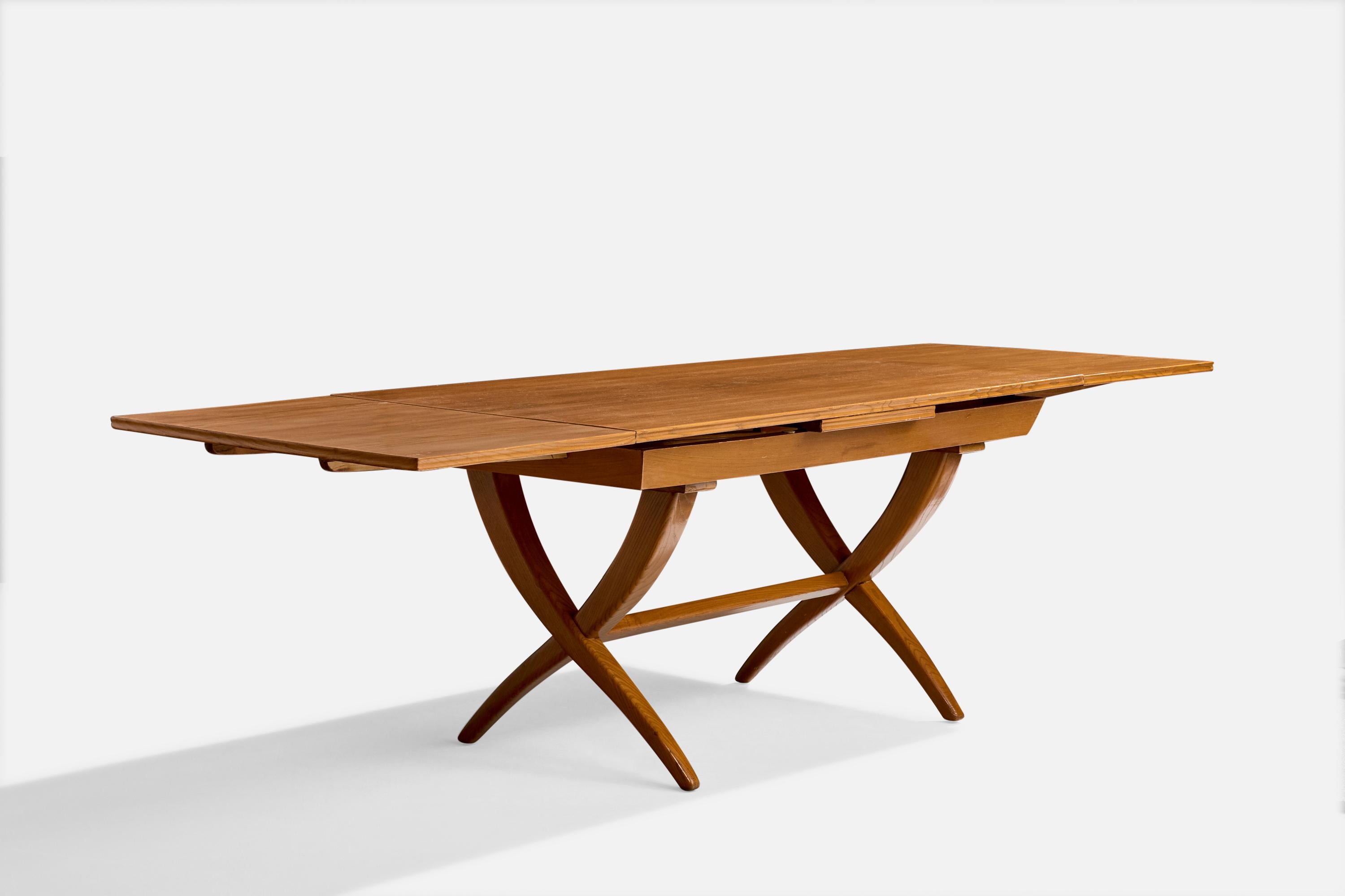 An extendible oak dining table designed and produced by Guglielmo Pecorini, Florence, Italy, c. 1951.

Provenance: Acquired at Lord & Taylor in 1951.

Overall Dimensions (inches): 30.25