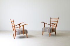 Guglielmo Pecorini's pair of shaped cherry wood armchairs