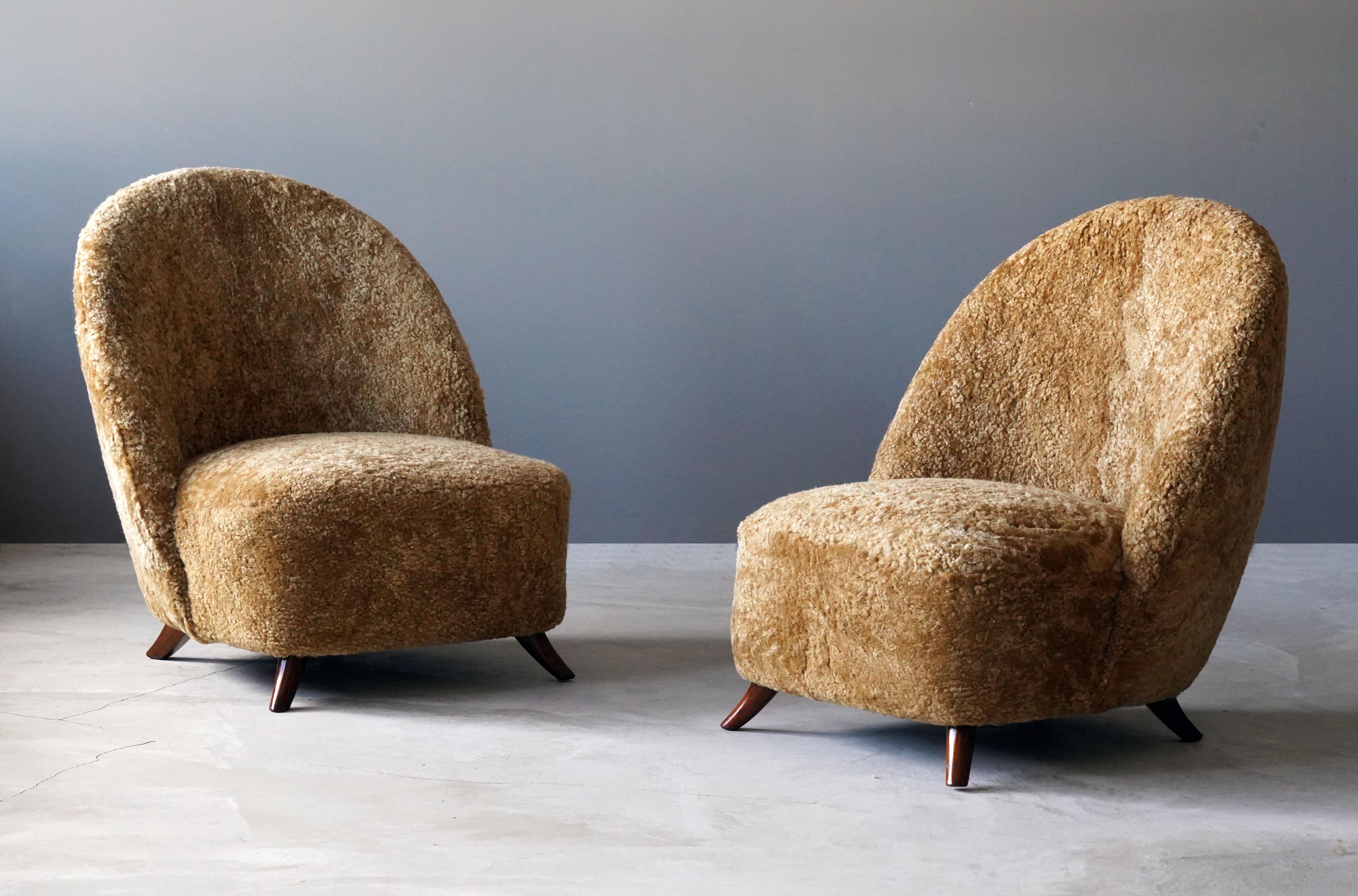 A pair of highly modernist lounge chairs. Designed attributed to Guglielmo Ulrich, produced 1940s, Italy. Features a highly expressive organic form.

Other designers working in the organic style include: Paolo Buffa, Gio Ponti, Flemming Lassen,
