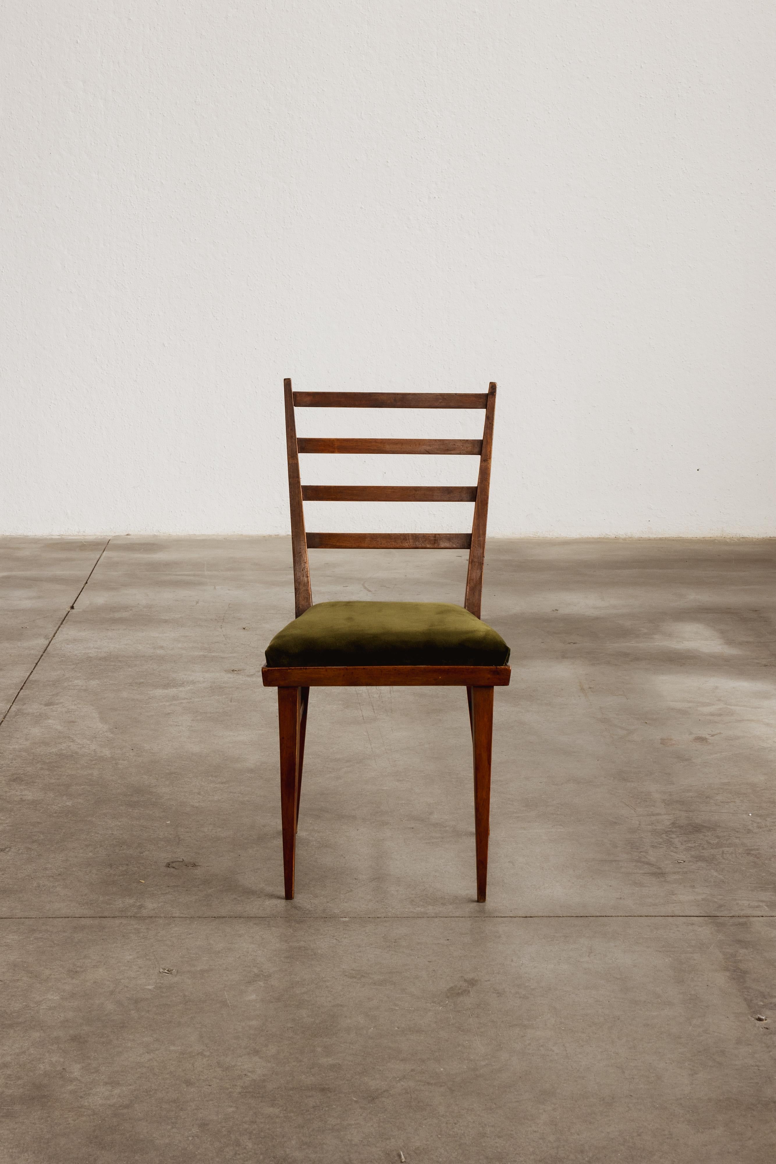 Guglielmo Ulrich Dining Chair for Saffa Milano, green velvet and wood, 1950

These 1950 dining chairs by Guglielmo Ulrich exemplifies the structural elegance of Italian mid-century design. Crafted in solid walnut, the frame integrates a single