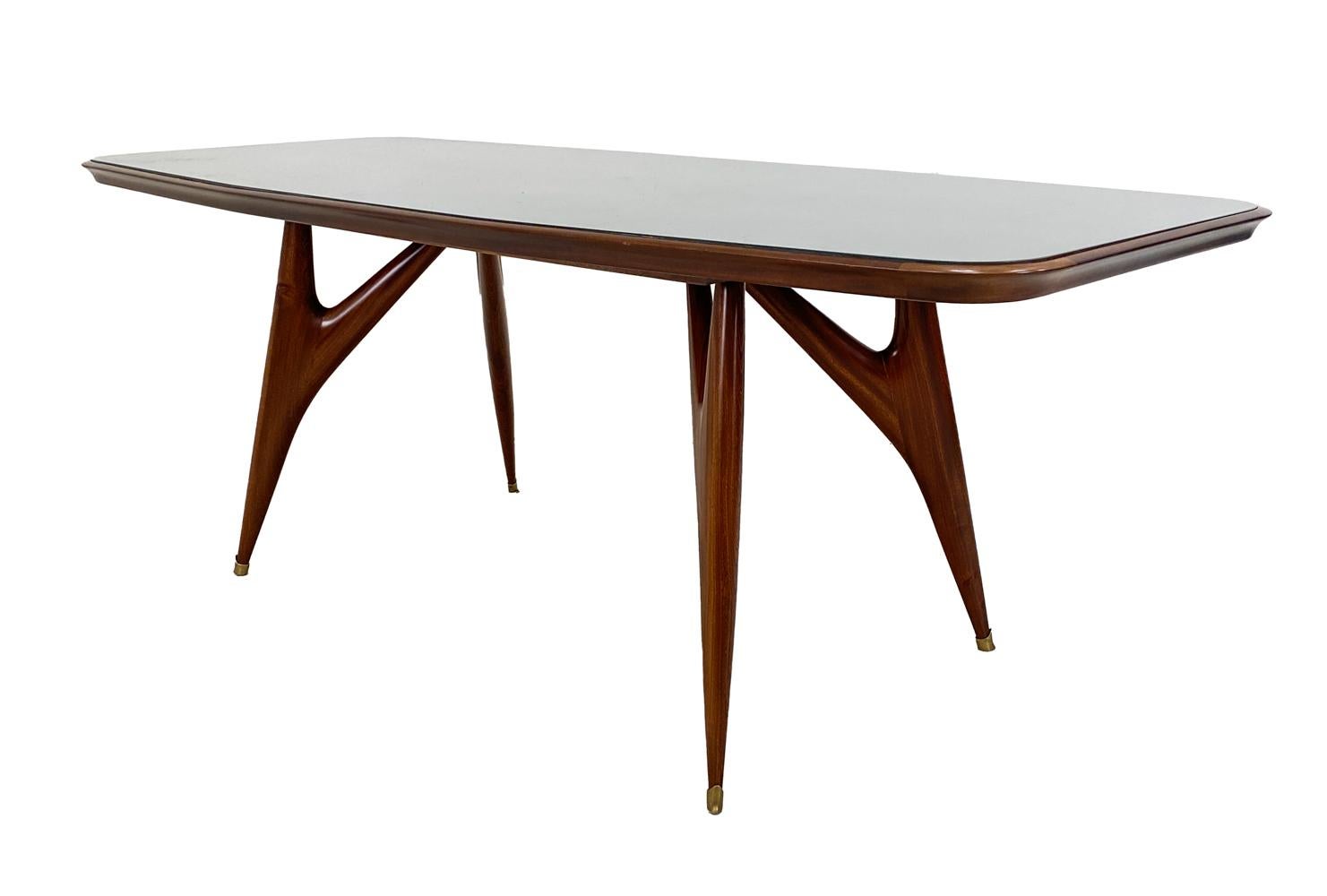 Exquisite sculptural dining table designed by Guglielmo Ulrich. Made in Italy. Apparently unmarked. 
 
 