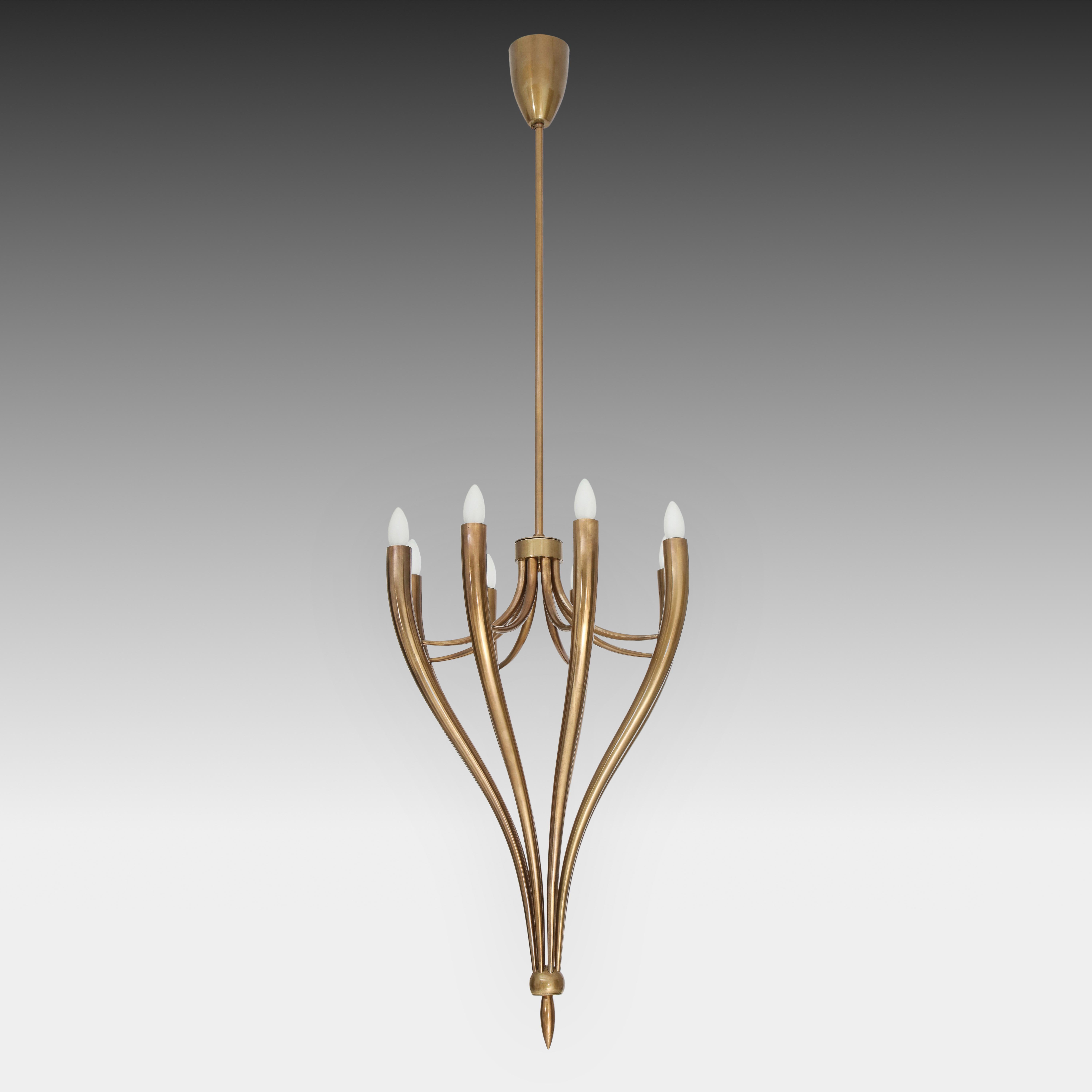 Guglielmo Ulrich rare and elegant brass chandelier with eight cascading arms ending on a brass point detail, Italy, 1940s. This stunning period chandelier makes a statement lighting piece with its large scale and sweeping curves. It is classical in