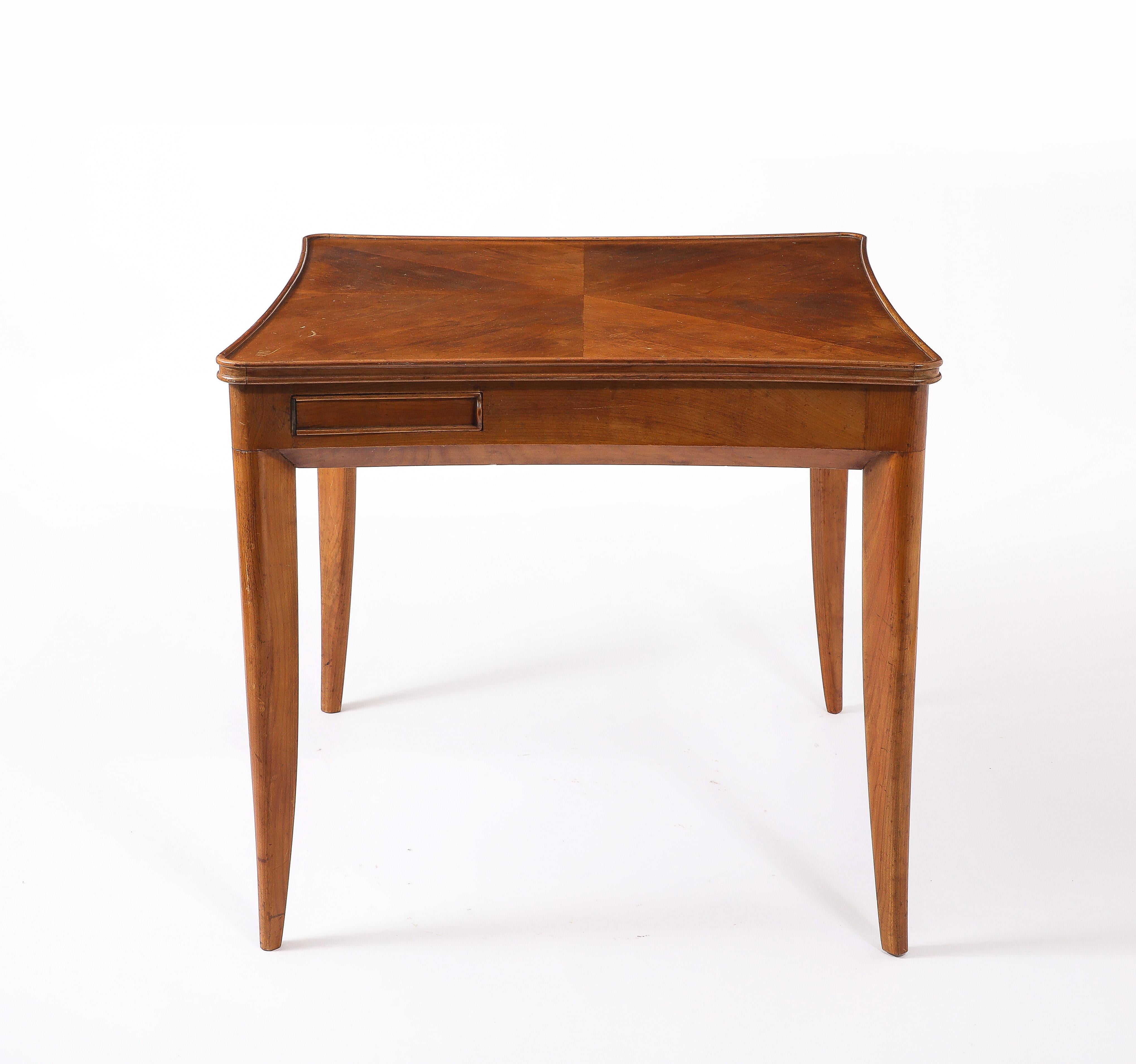 Flip top game table, when not in use the wood top has a sun marquetry, on the flip side, a velvet insert lets you play cards, each player has it’s own little pull out drink tray.