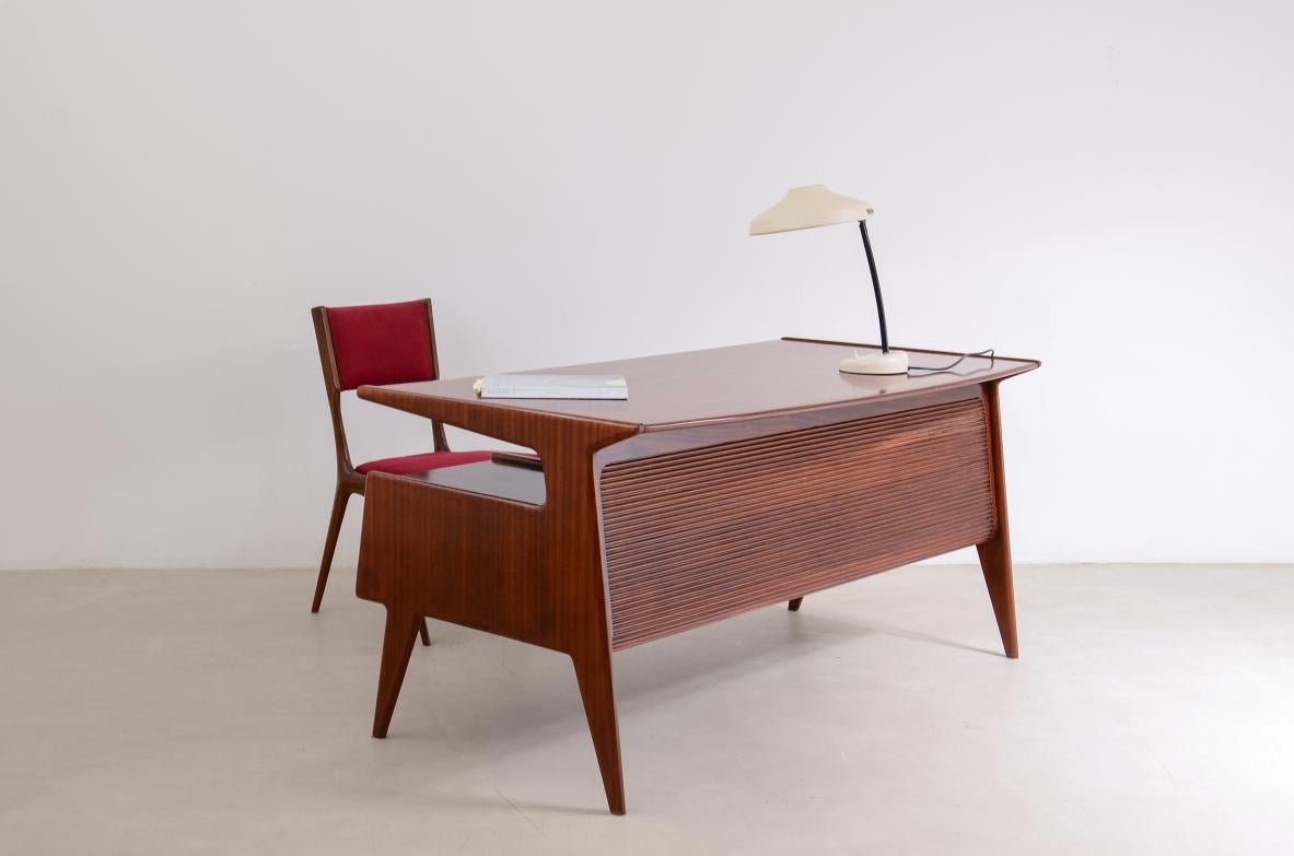 Wood splendid executive desk in the style of Ulrich with four drawers For Sale