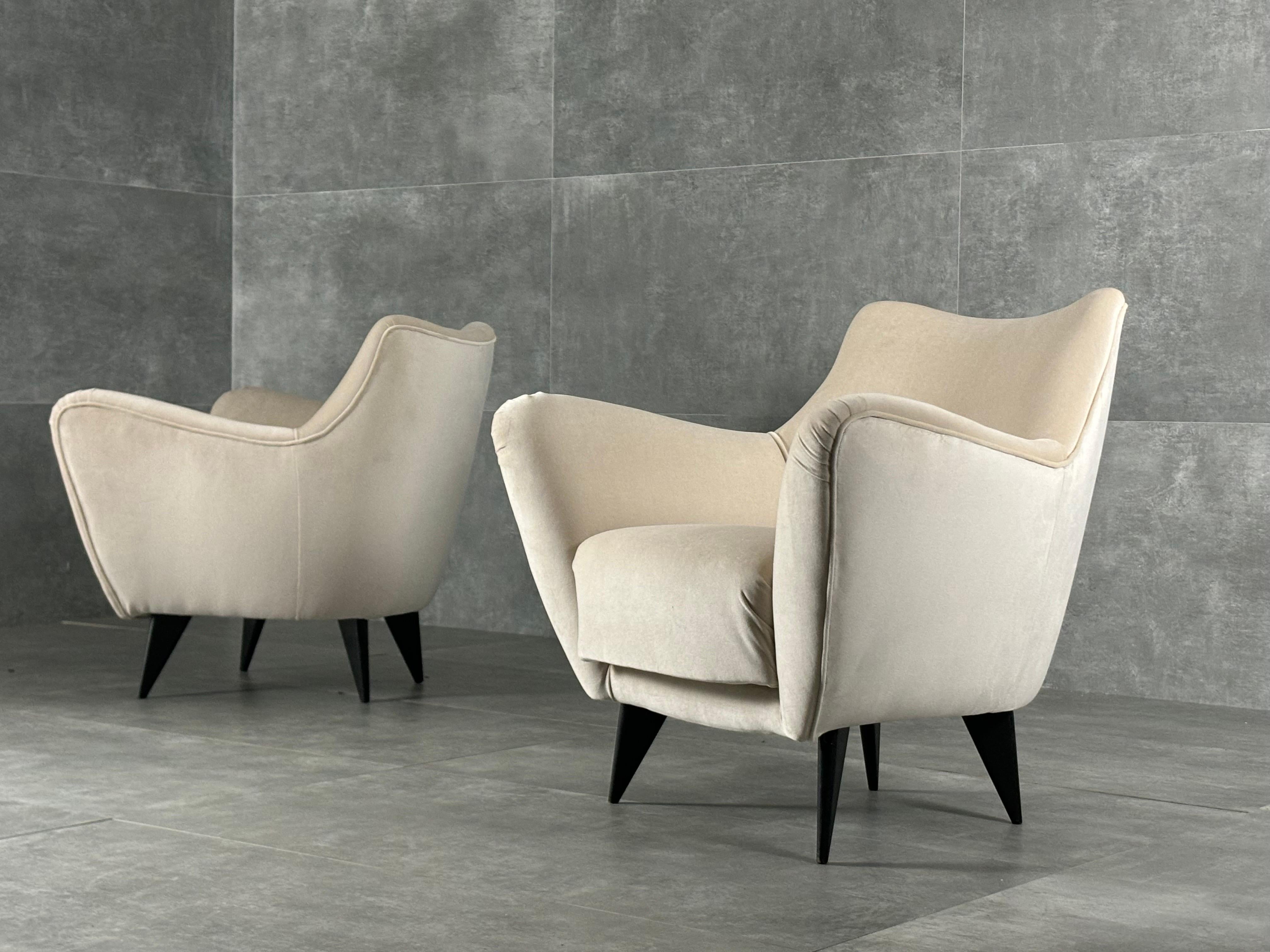 Armchairs by Guglielmo Veronesi for ISA Bergamo, Italy, 1950s. These armchairs are newly upholstered with ivory velvet.