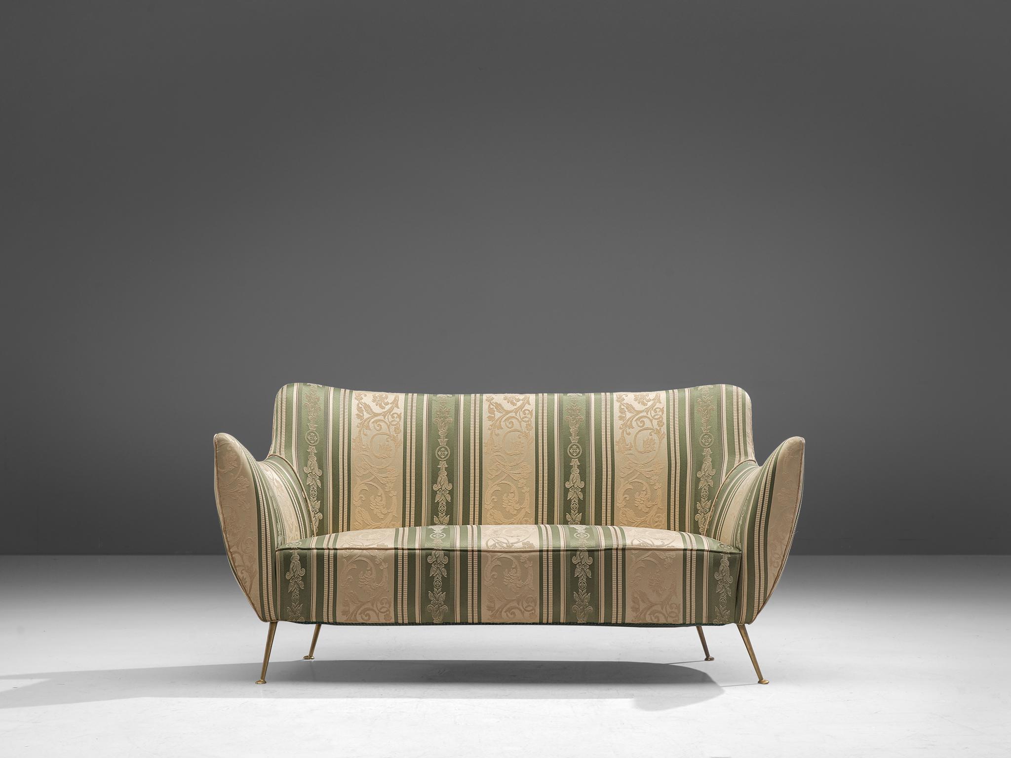 Guglielmo Veronesi for I.S.A Bergamo, sofa, brass, fabric, Italy, 1952.

This wingback sofa is an iconic example of Italian design from the fifties. Curvaceous, organic and sculptural, this two-seater sofa is anything but minimalistic. The small,