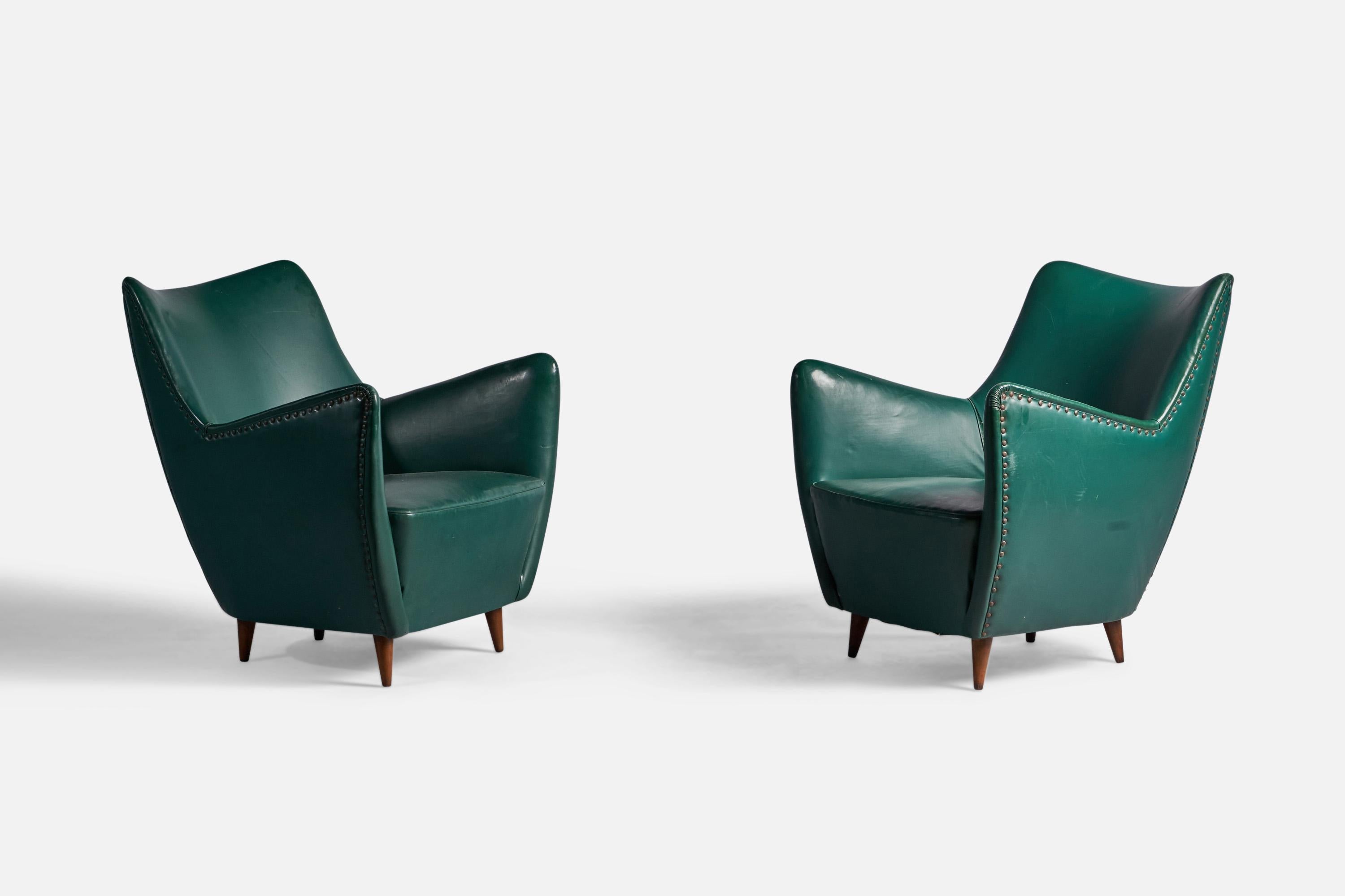 A pair of green vinyl wood and brass lounge chairs, designed by Guglielmo Veronesi and produced by ISA Bergamo, Italy, 1950s.

Seat height: 16.5