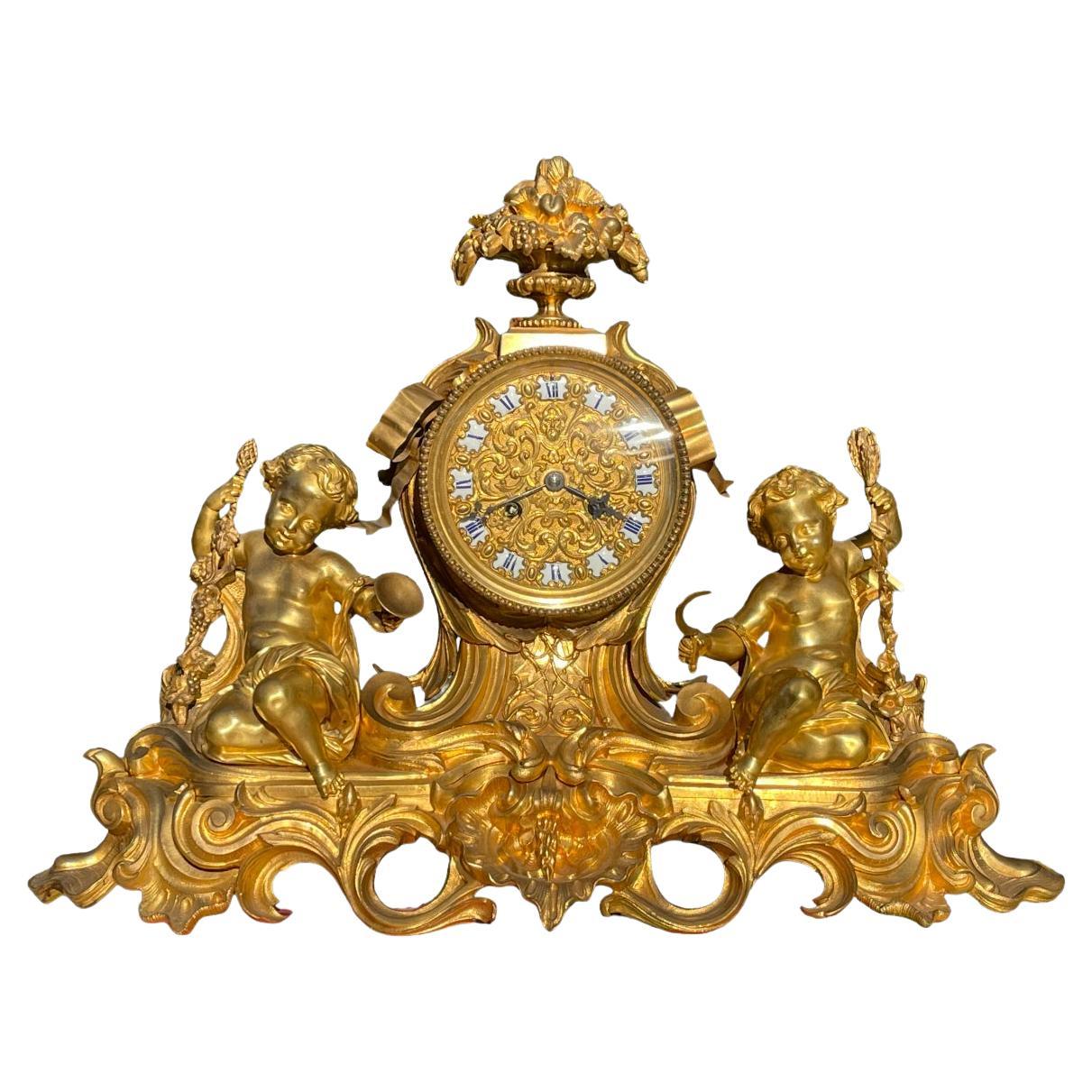 GUICHE Palais Royal - Horloge en bronze doré avec puttis en vente