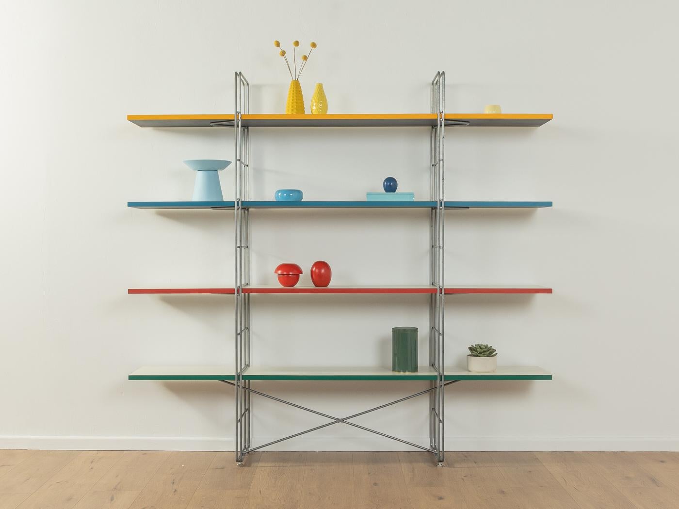 Rare GUIDE shelf by Niels Gammelgaard for IKEA from the 1980s. Powder-coated metal frame in matt grey with four chipboard shelves in white with colored edges.

Quality Features:

    good workmanship
    high quality materials
    Made in Sweden,