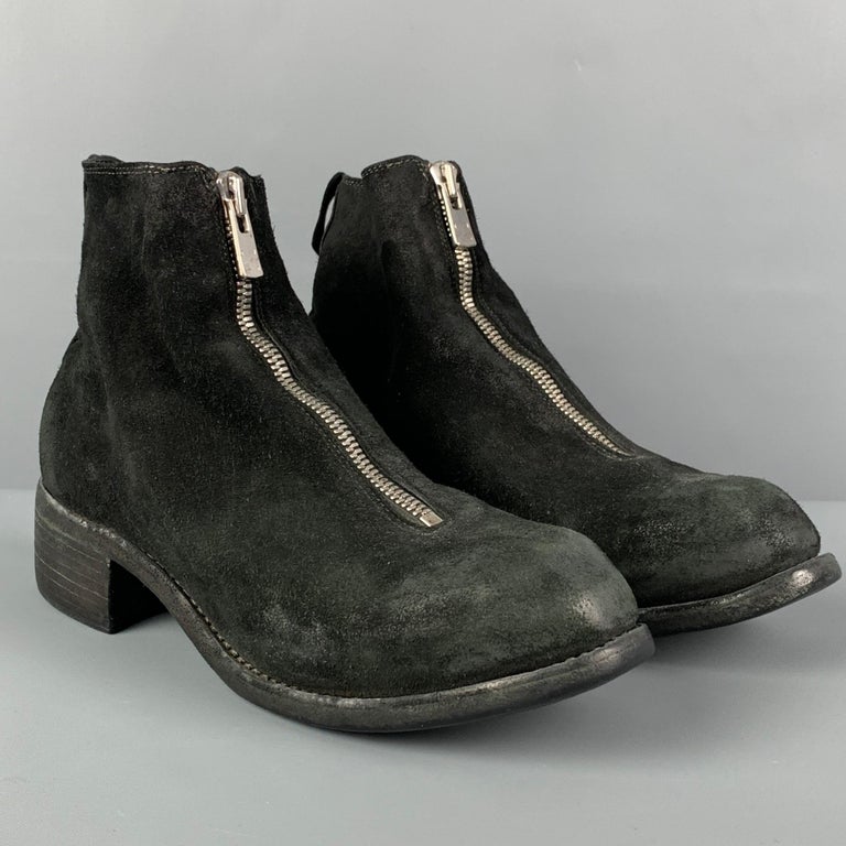 GUIDI ankle boots comes in a black distressed suede featuring a round toe, chucky heel, anda front zipper closure. 

Good Pre-Owned Condition.
Marked: 38

Measurements:

Length: 10.75 in.
Width: 3.5 in.
Height: 5.25 in. 